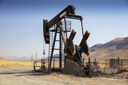 a group of children sitting on steps in front of a building