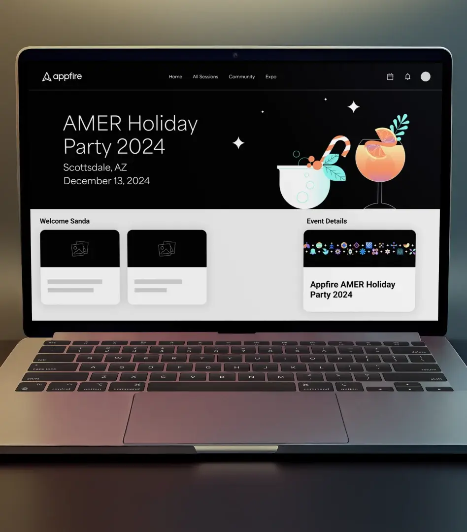 Laptop screen showing the Appfire AMER Holiday Party 2024 event site with welcome cards and event details.