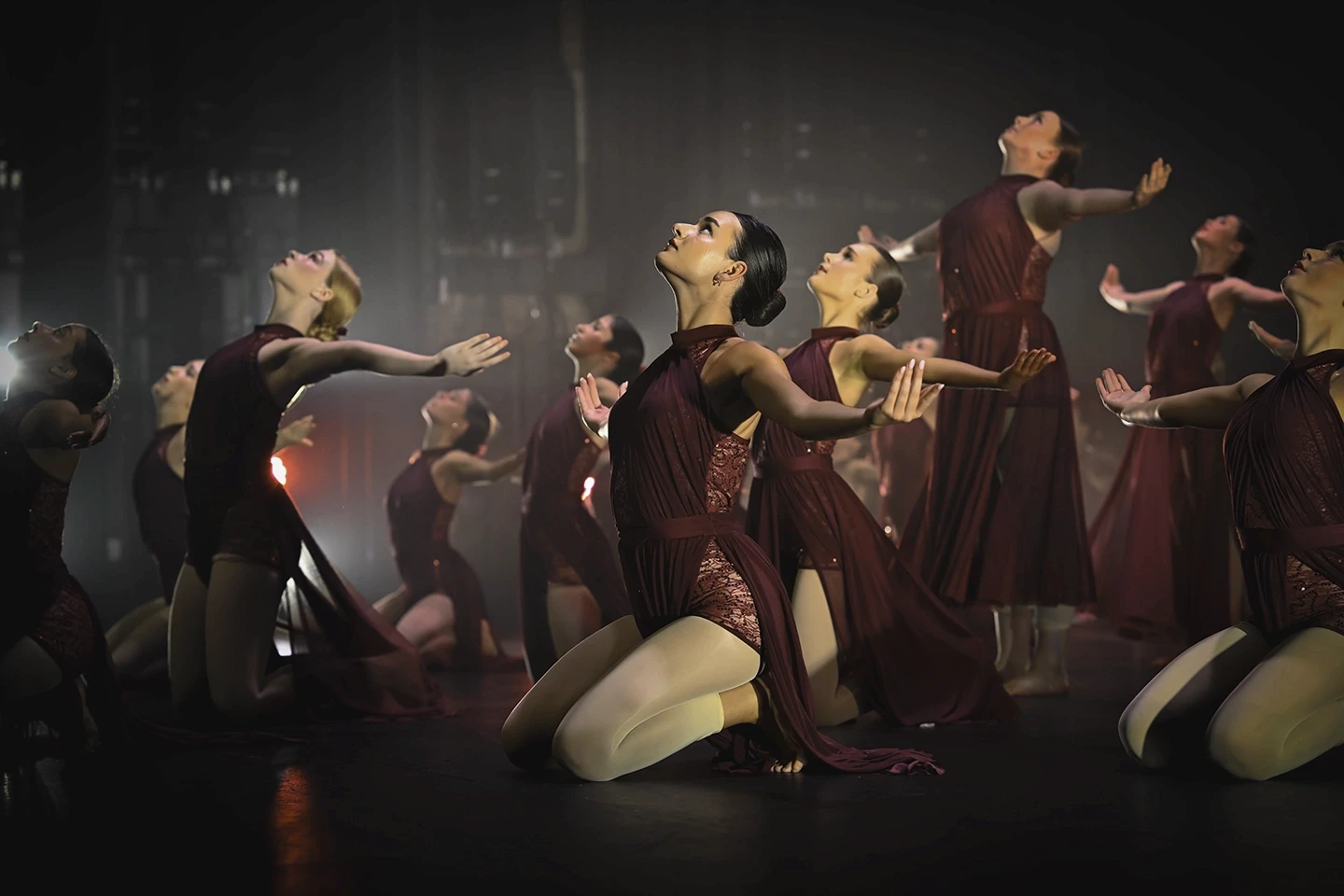 Dancers kneeling on stage