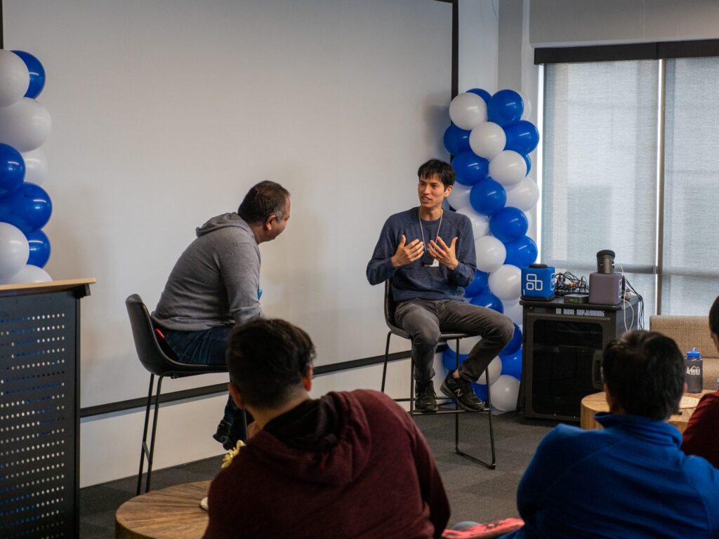 Ashu Garg leading the conference.