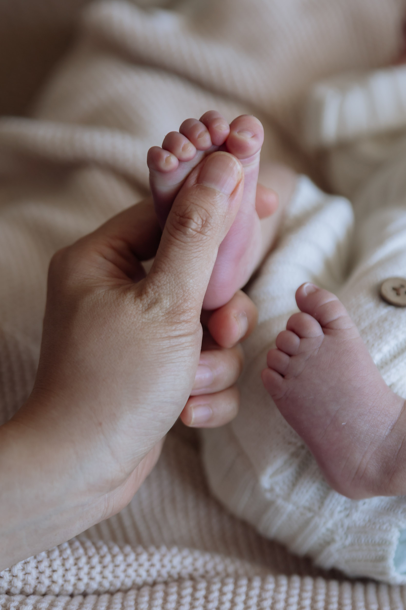 Minimalist studio newborn portrait baby's foot in Mackay
