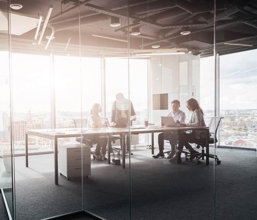 A silhouette of a person standing amidst vibrant swirling colors of teal and orange.