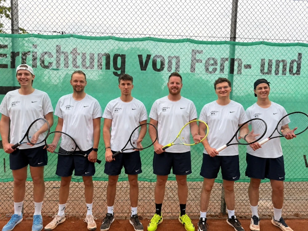 four men playing double tennis during daytime