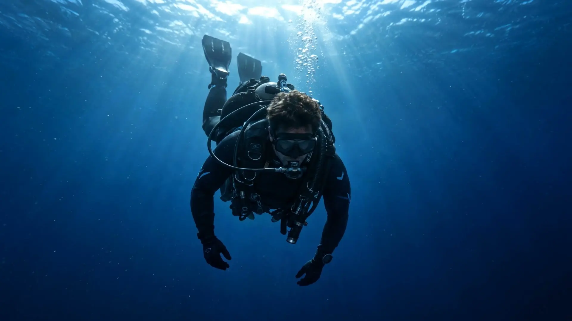 Diver entering the water from the dive boat