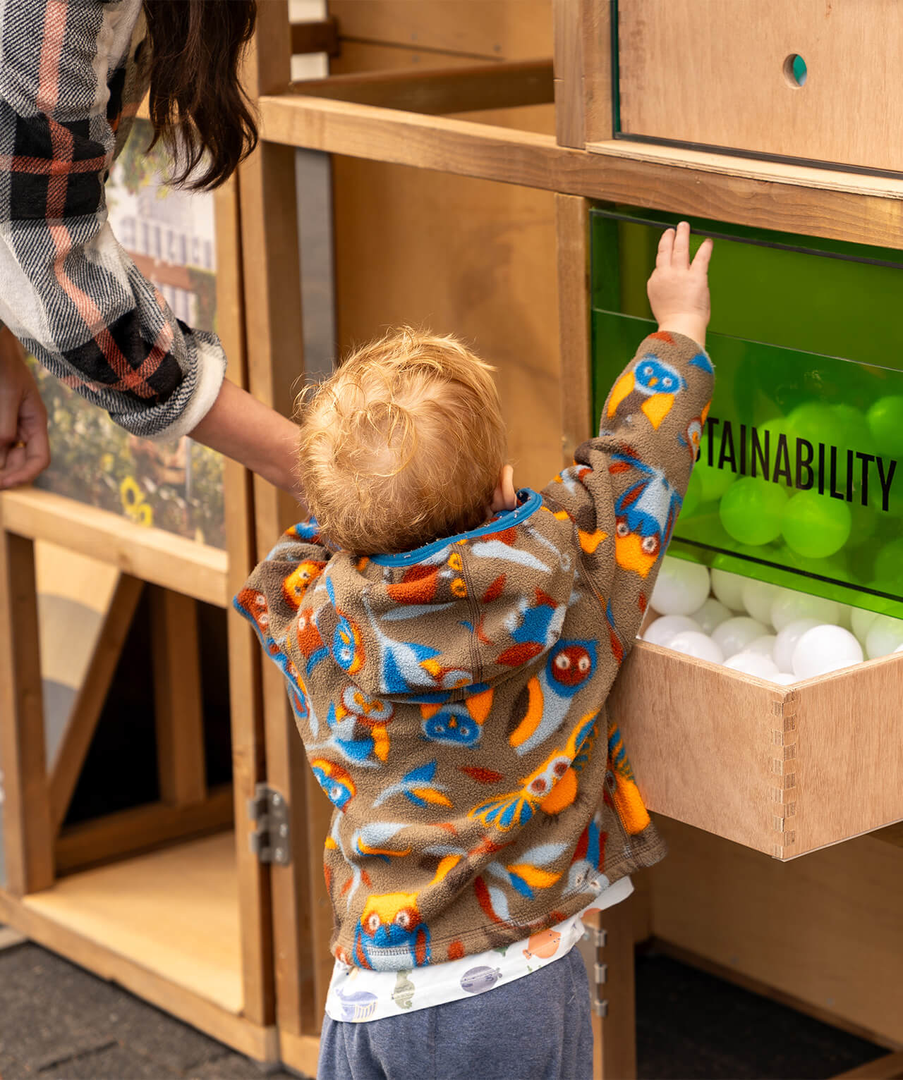 A young child interacting with the structure.