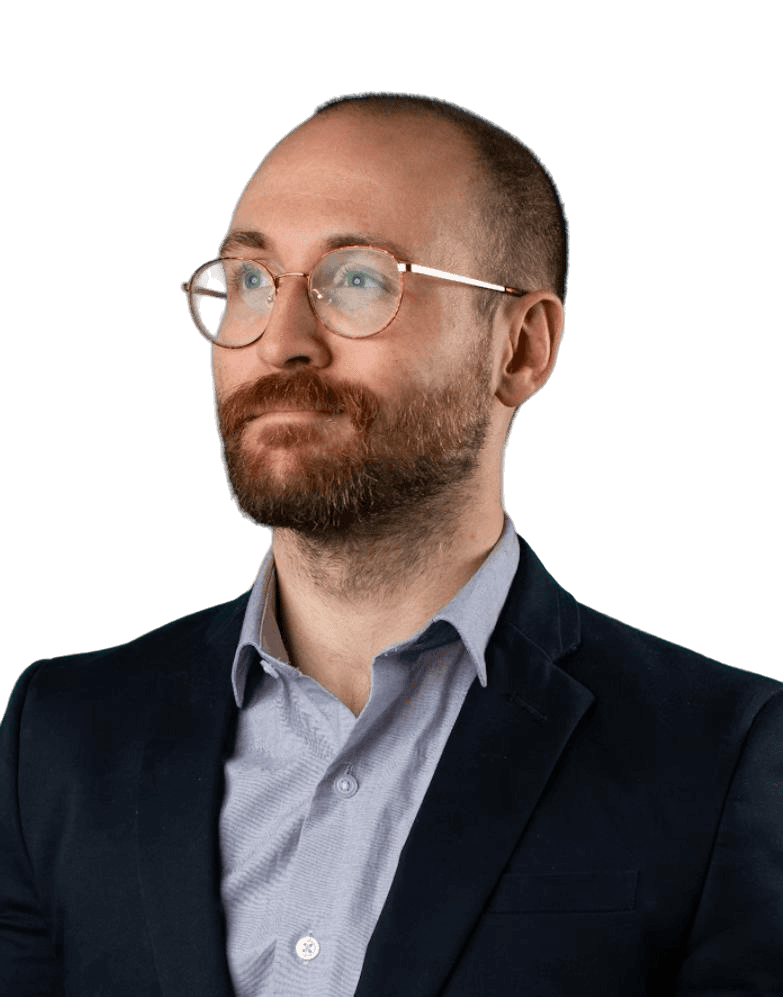 a man in a suit standing in a room