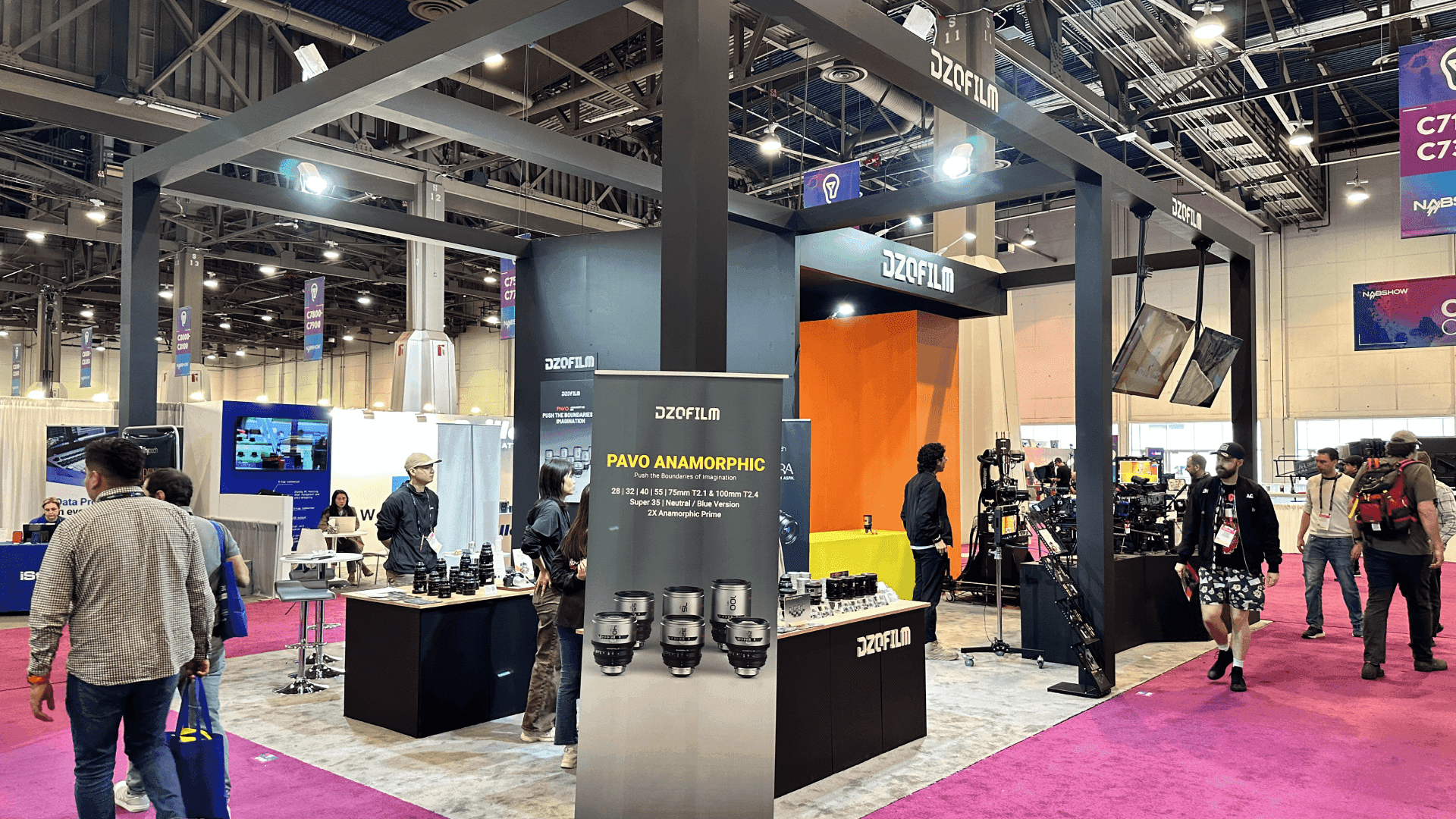 DZOFilm NAB 2024 20x40 broadcast technology booth with camera demo zones and overhead branding at Las Vegas Convention Center