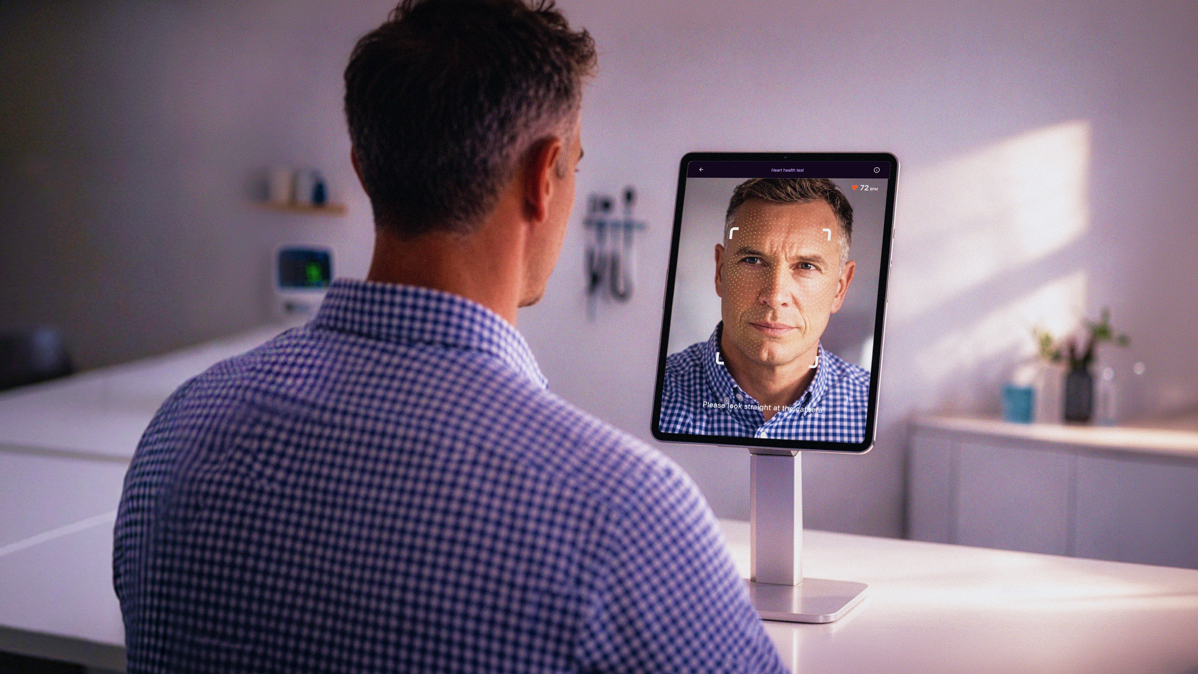 kids lying on a glass land and smiling