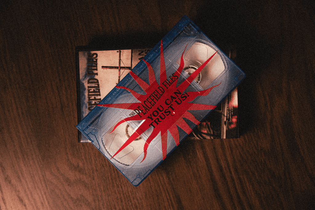 A fast black sports car races down the highway.