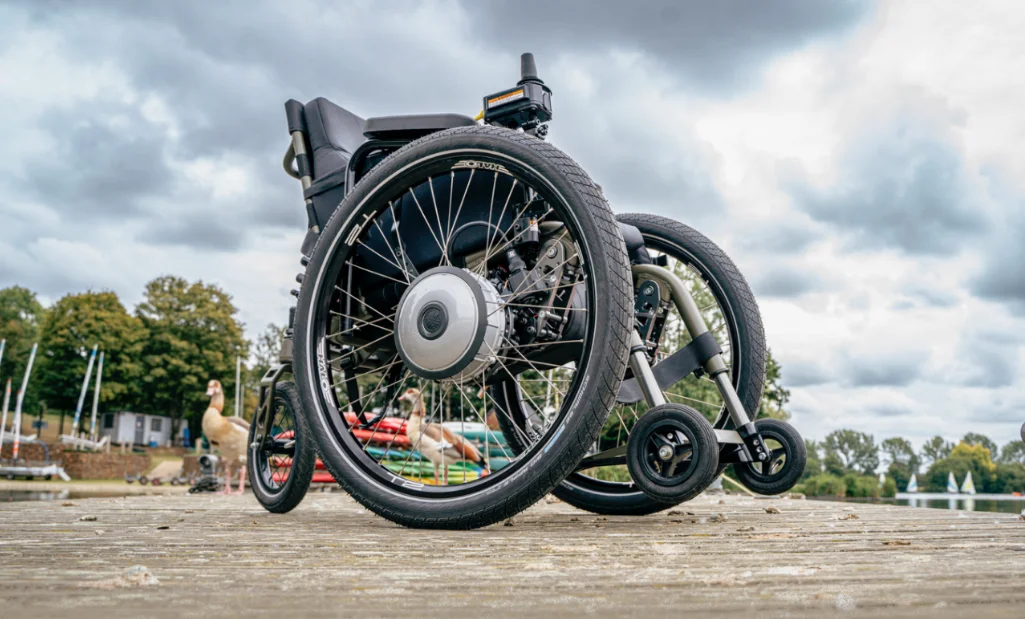 Lower sdie view of black SD Motion Trike on a boardwalk