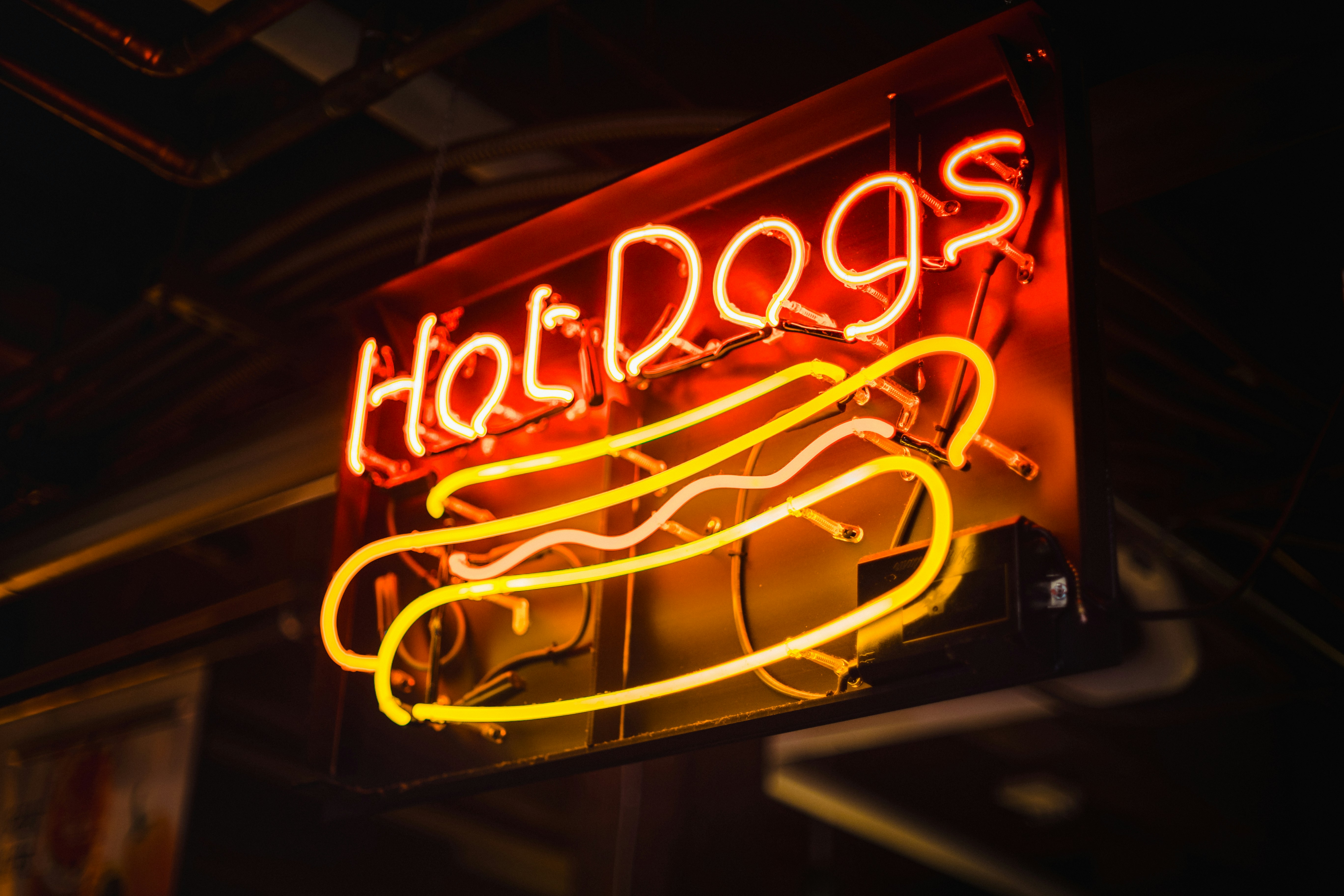 Red and yellow neon sign for hot dogs