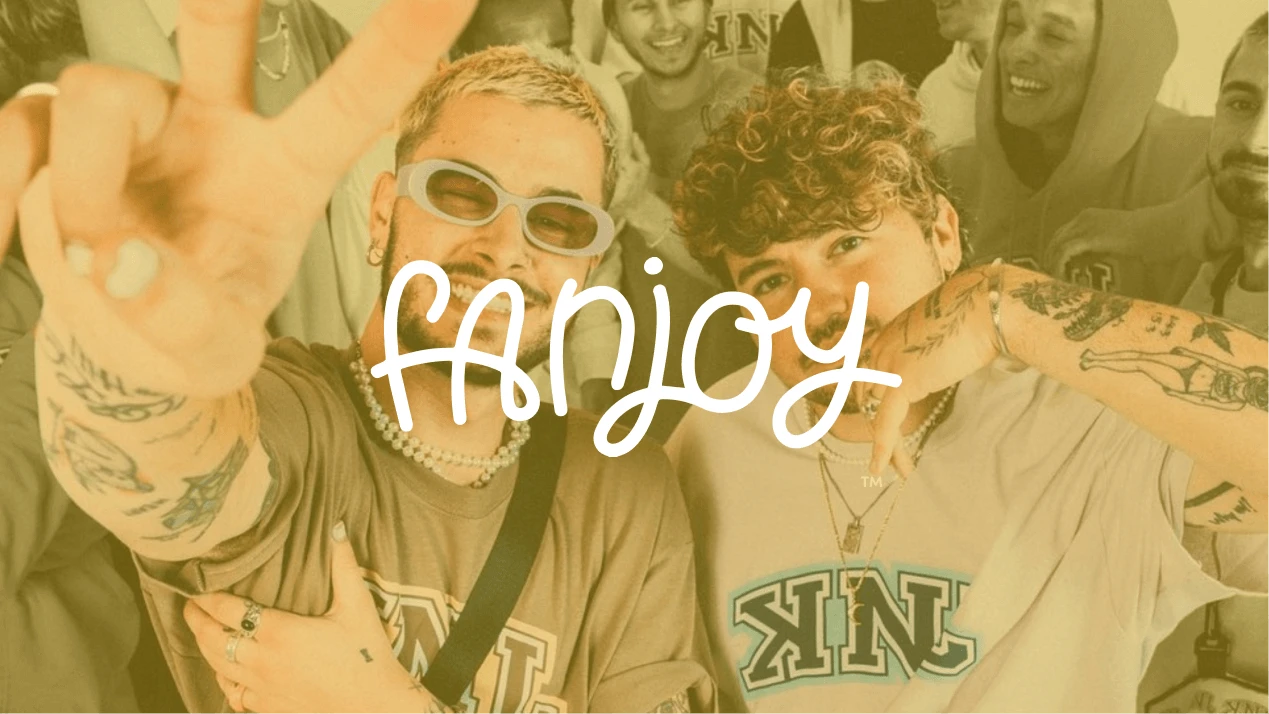 Post Malone, a smiling man with a beard and tattoos, wearing a denim jacket, posed against a neutral background.