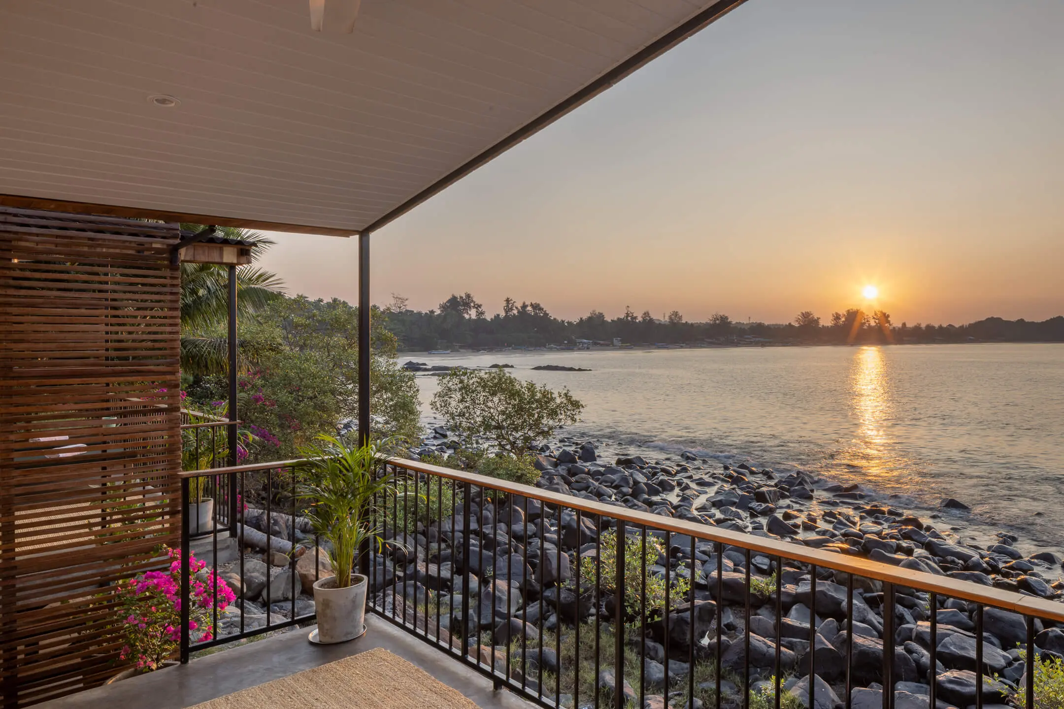 Grand Sea View Room 9 at Casa Jaali — golden hour from the balcony rail