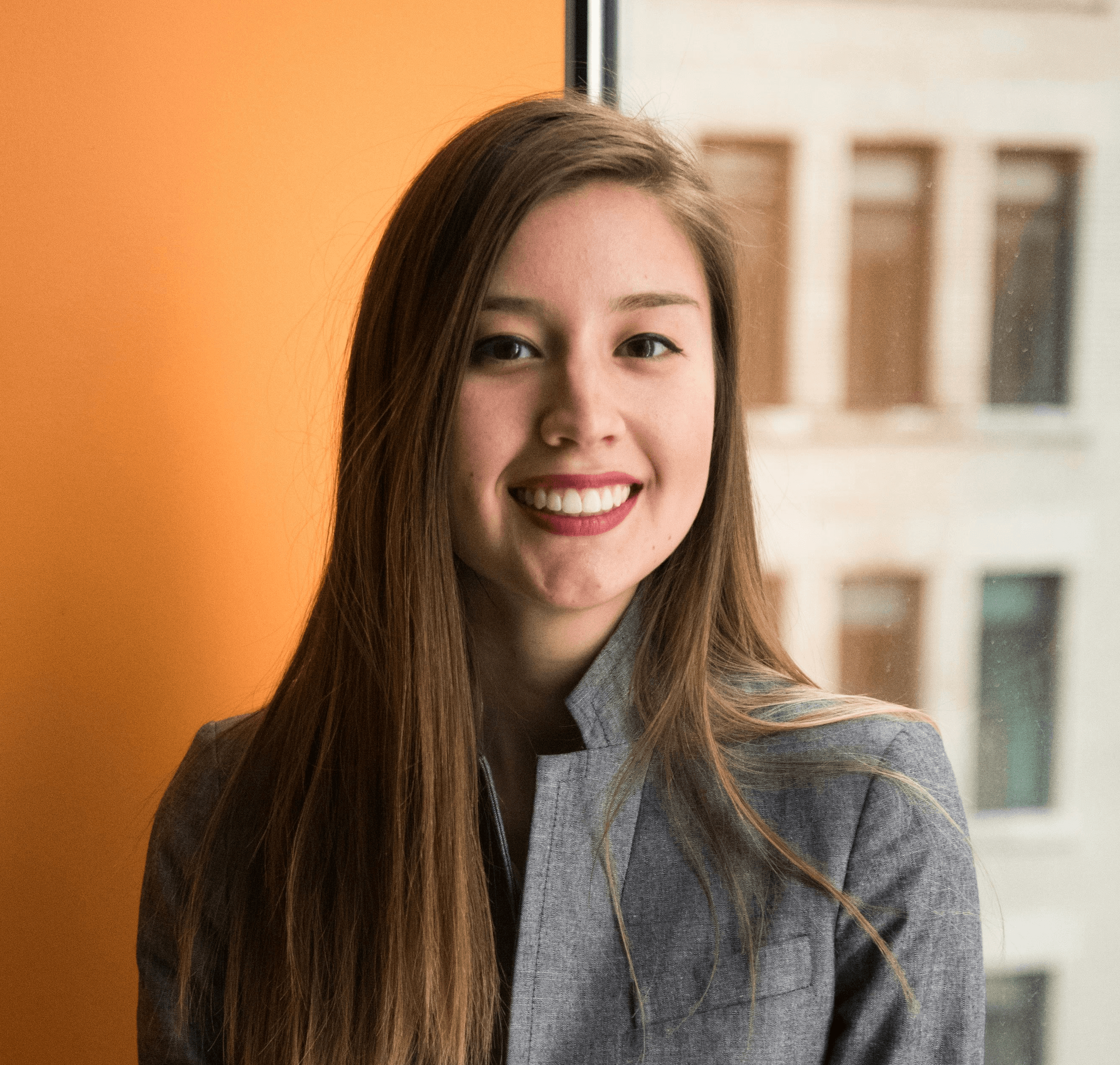 shallow focus photo of woman in gray jacket