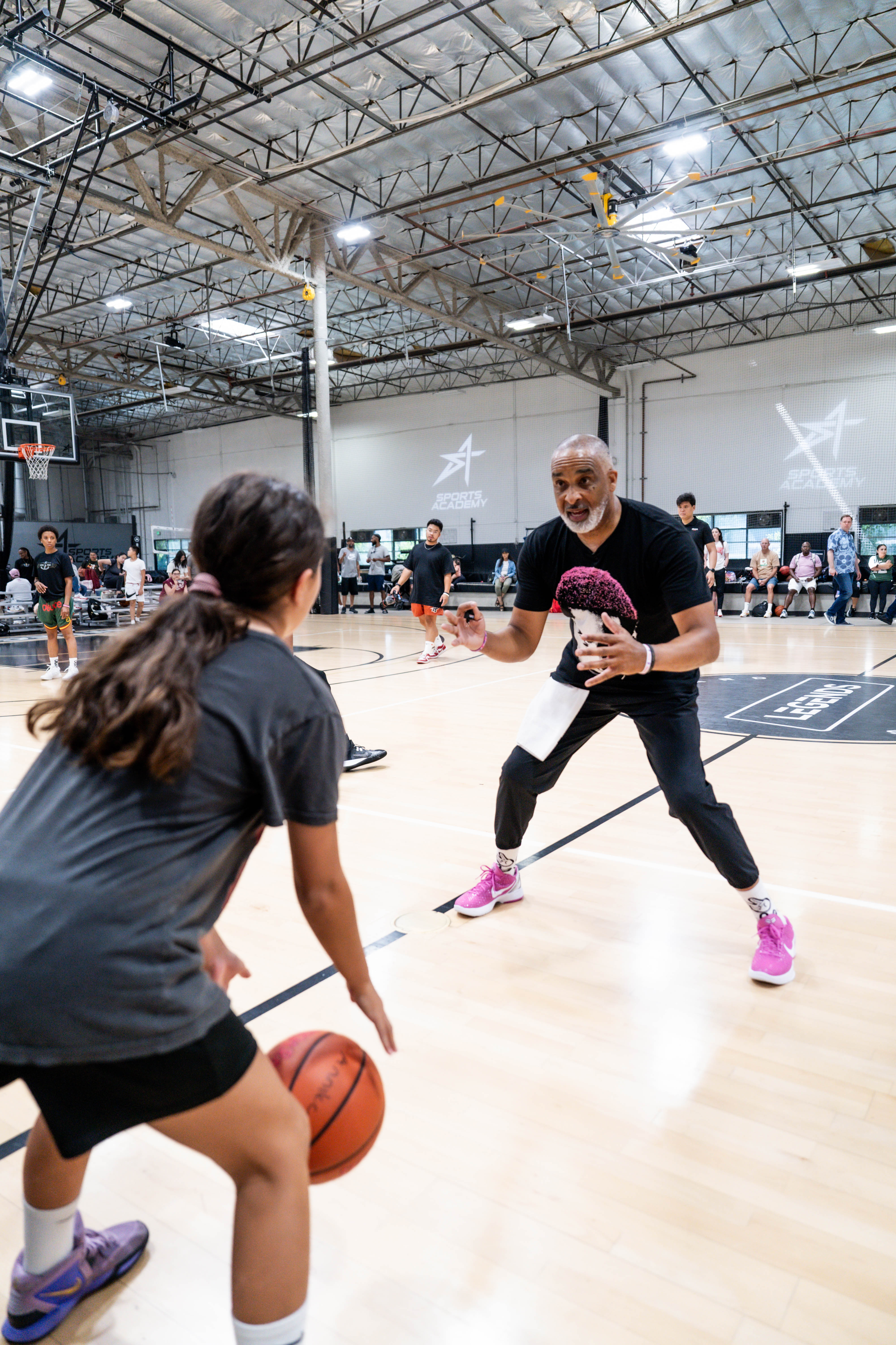 Coach Handy teaching a dribbling drill