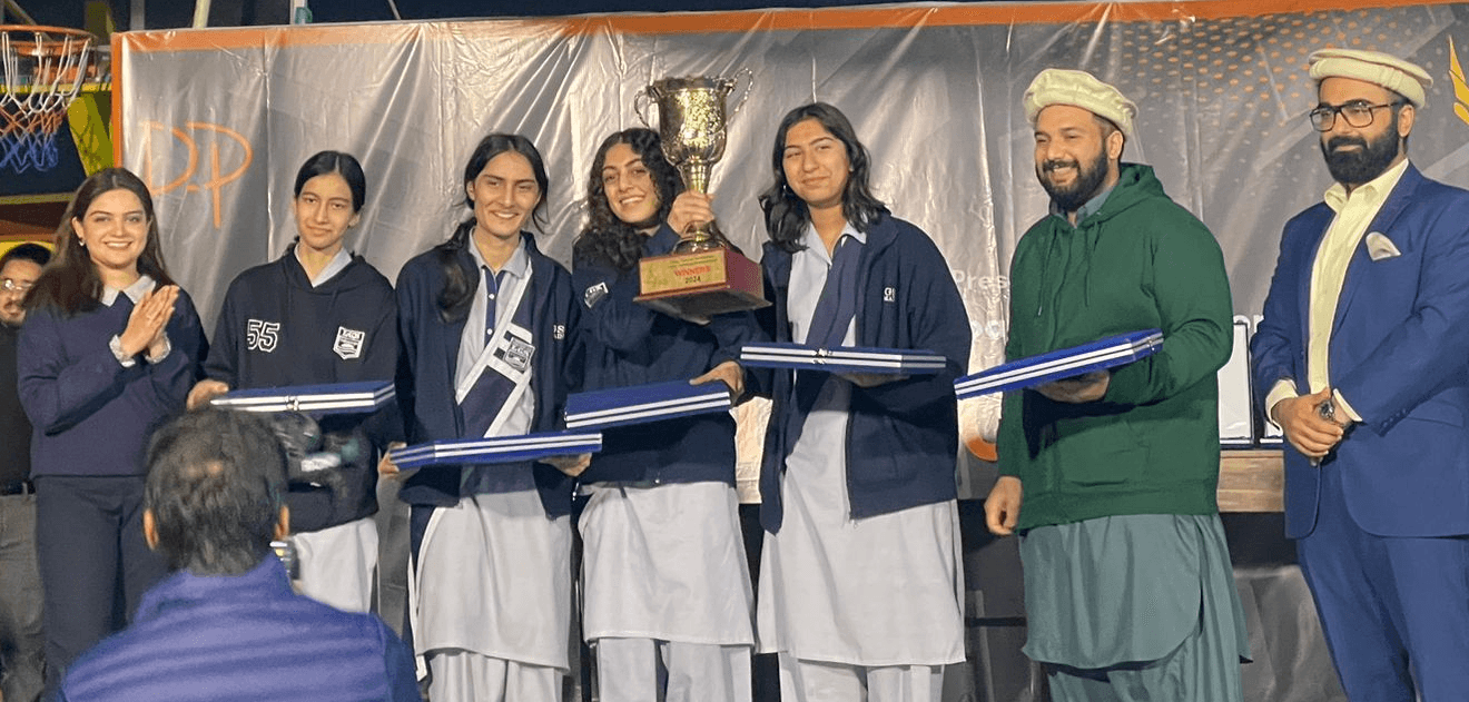 Sarah and her team winning an award at a ceremony