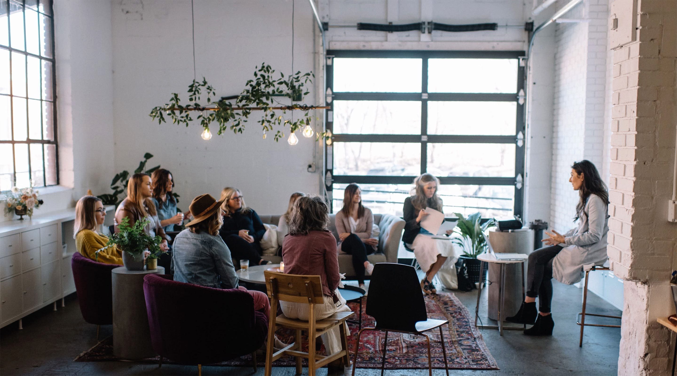 Group of people in a room meeting