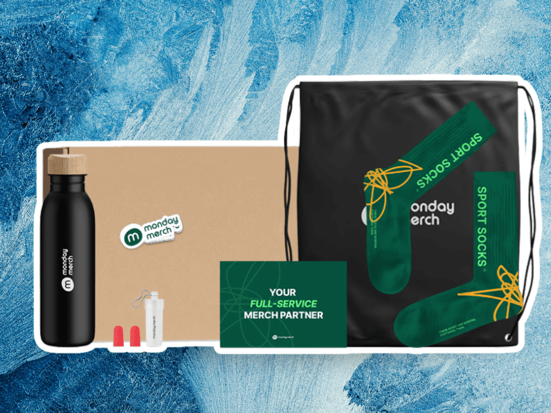 Branded black water bottle with bamboo lid beside Monday Merch sticker