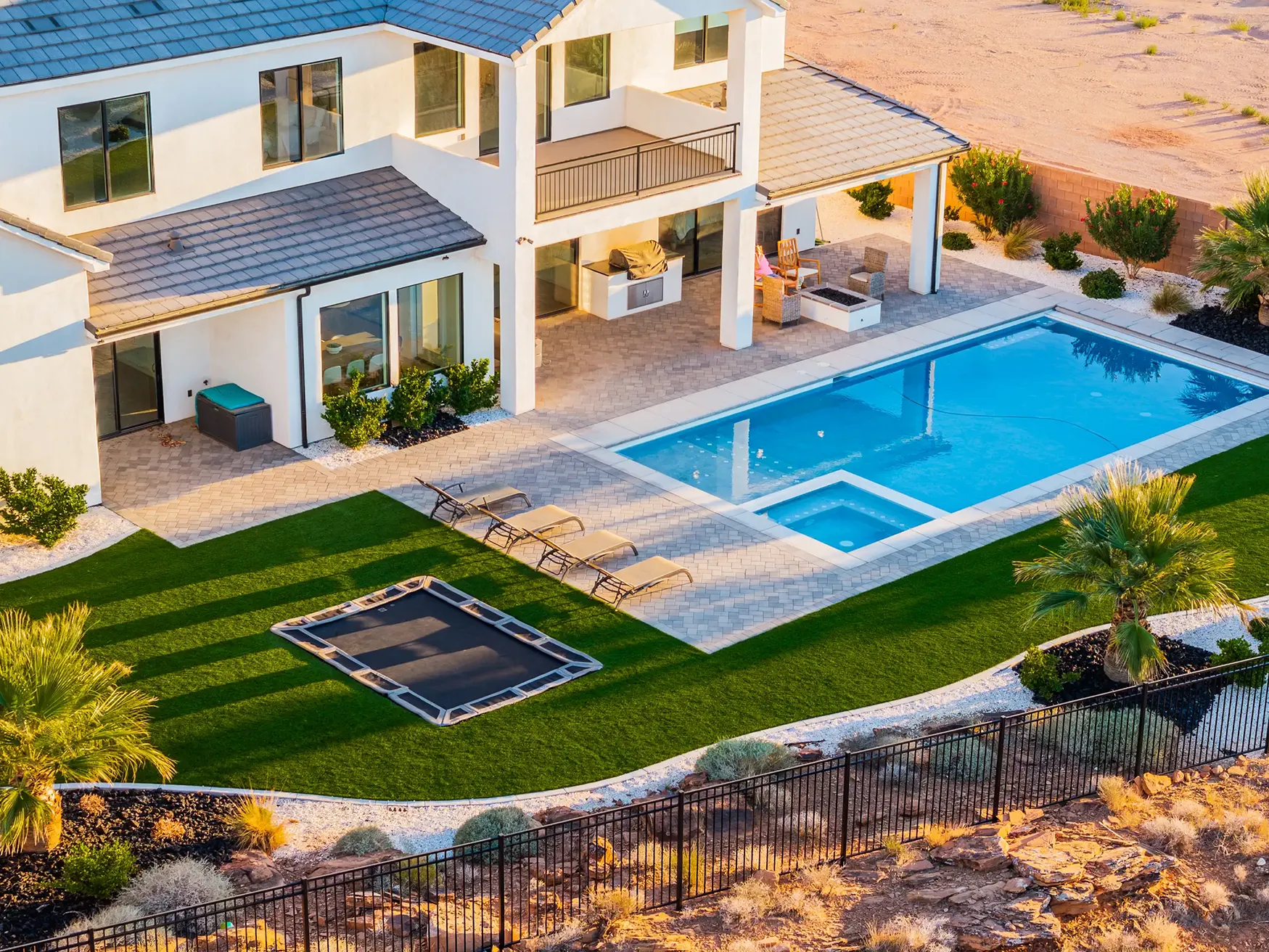 Exterior stylized aerial of a pool in a backyard