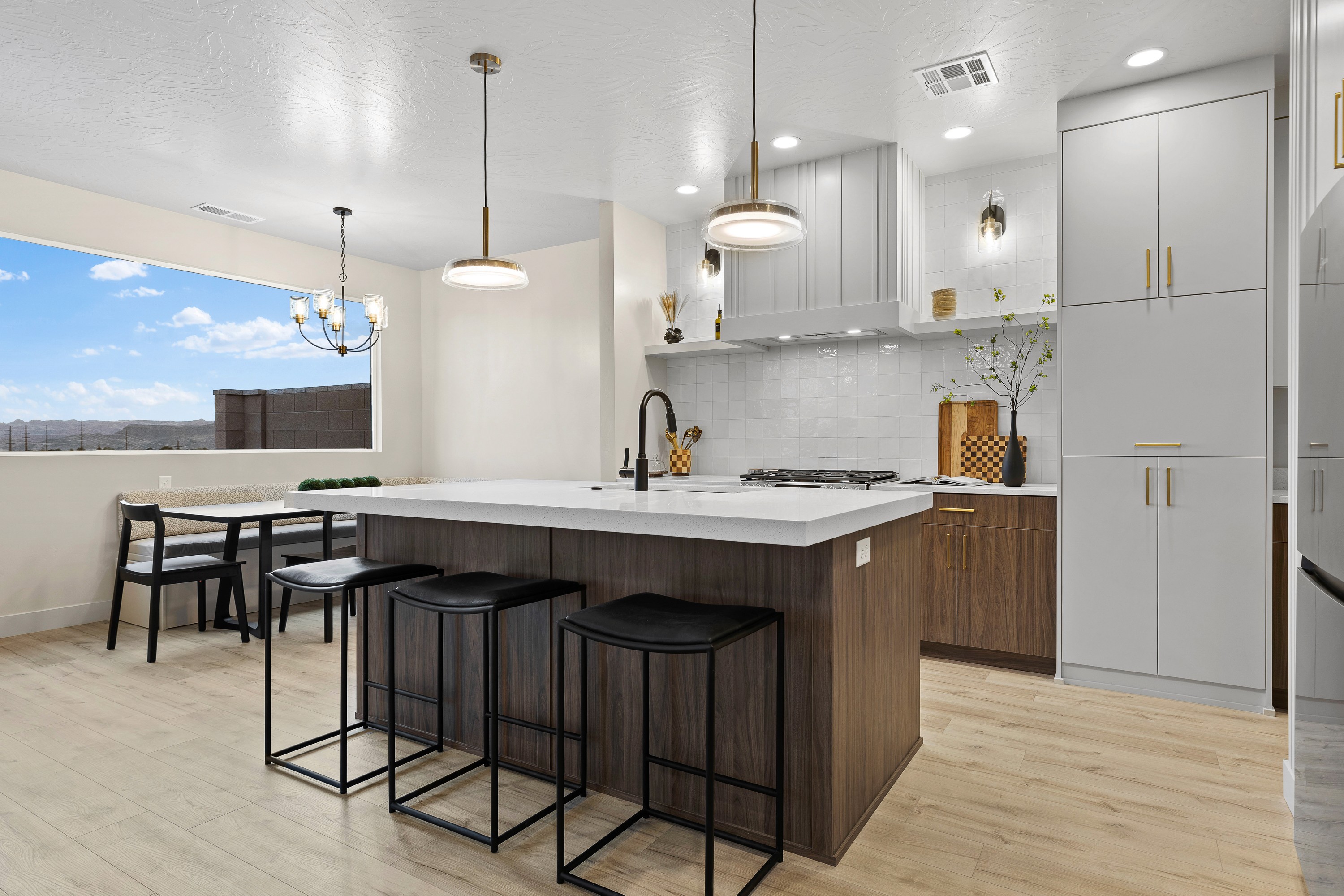Kitchen inside The Painted Horizon twin home in Hurricane, Utah featuring modern cabinetry and an efficient layout.
