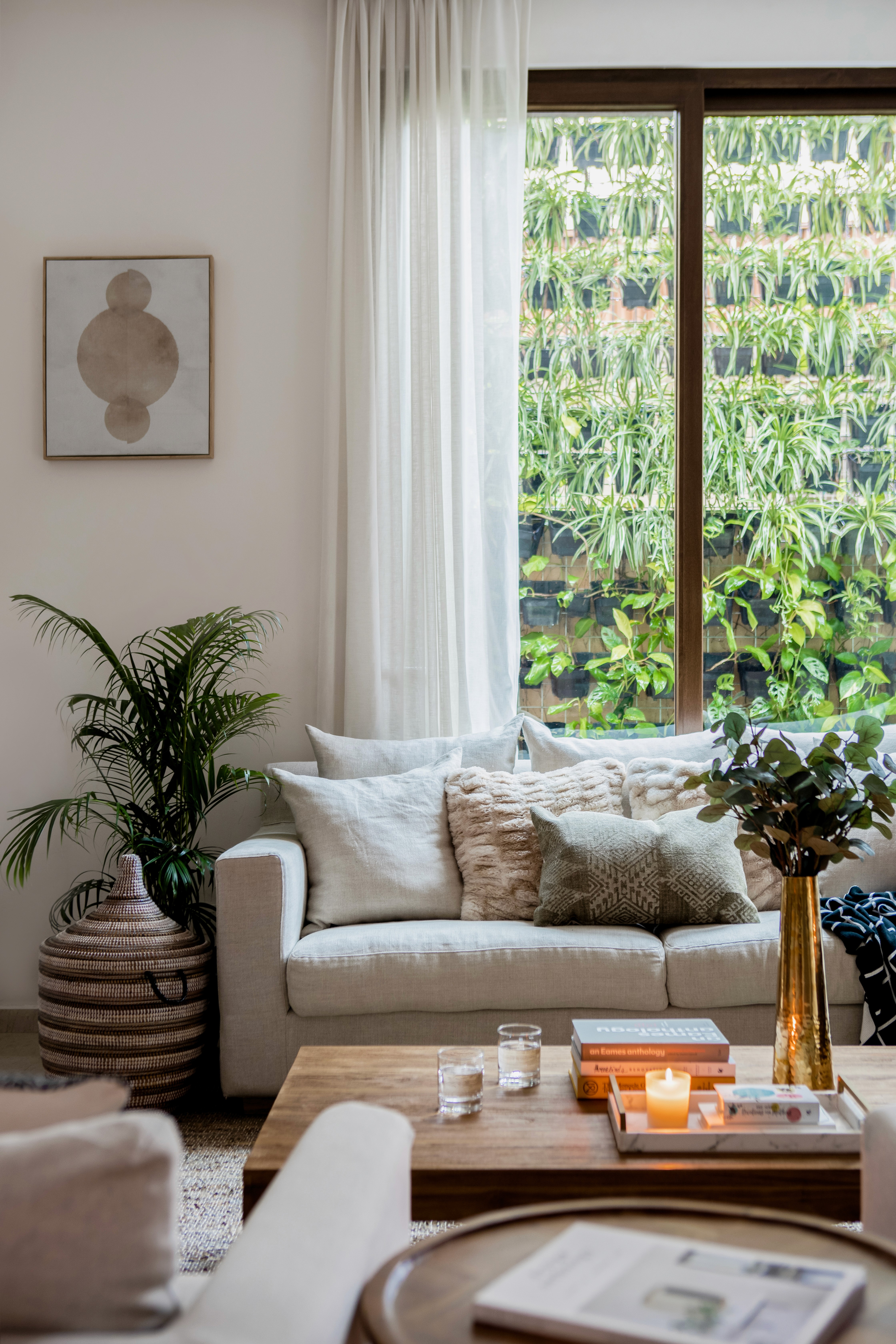 Boho chic living room sofa with a mix of patterns, textures, and colors by Ventura & Los Angeles interior designer Jubilee Interiors