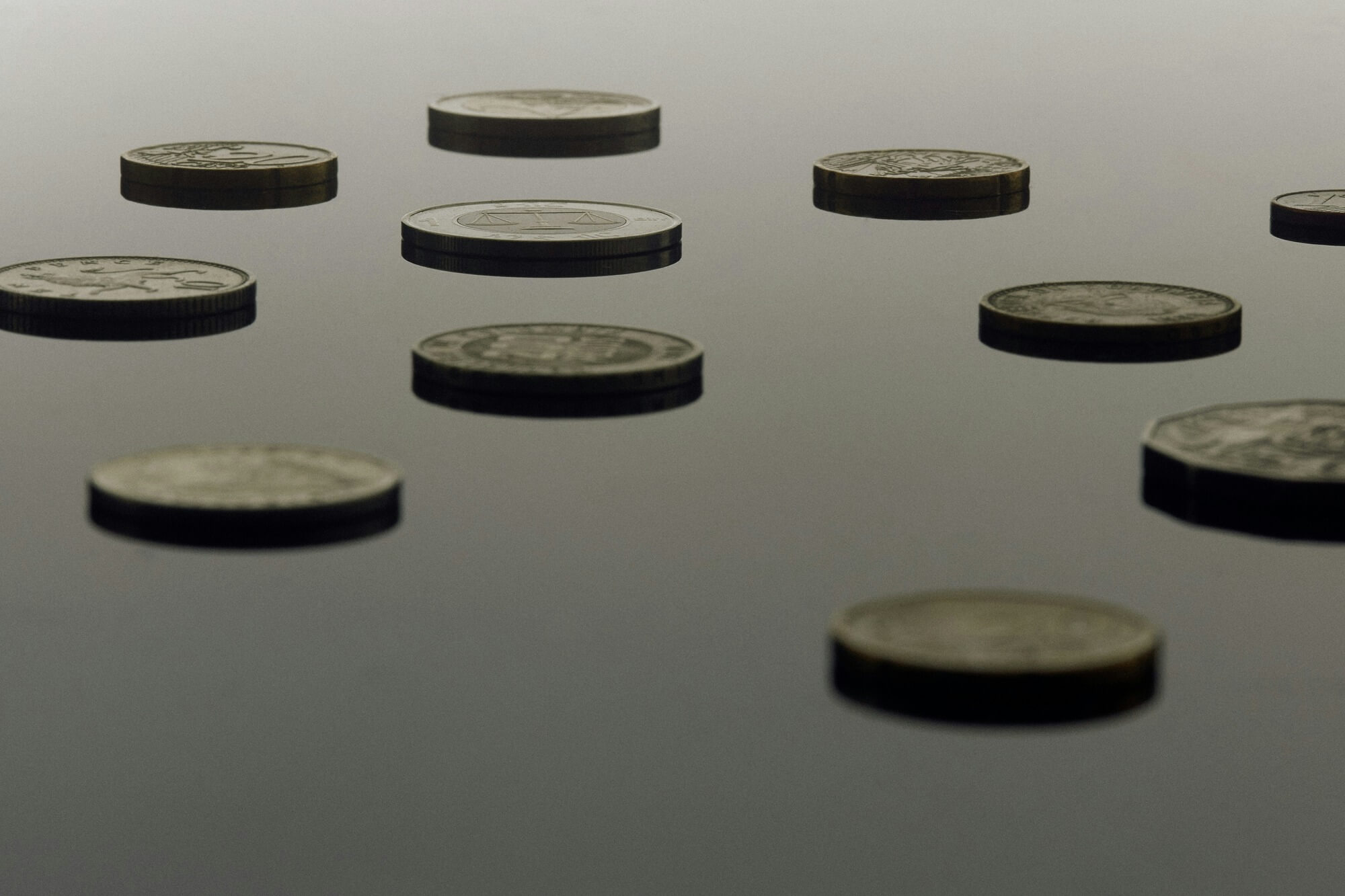 Coins floating in a mysterious, grey space