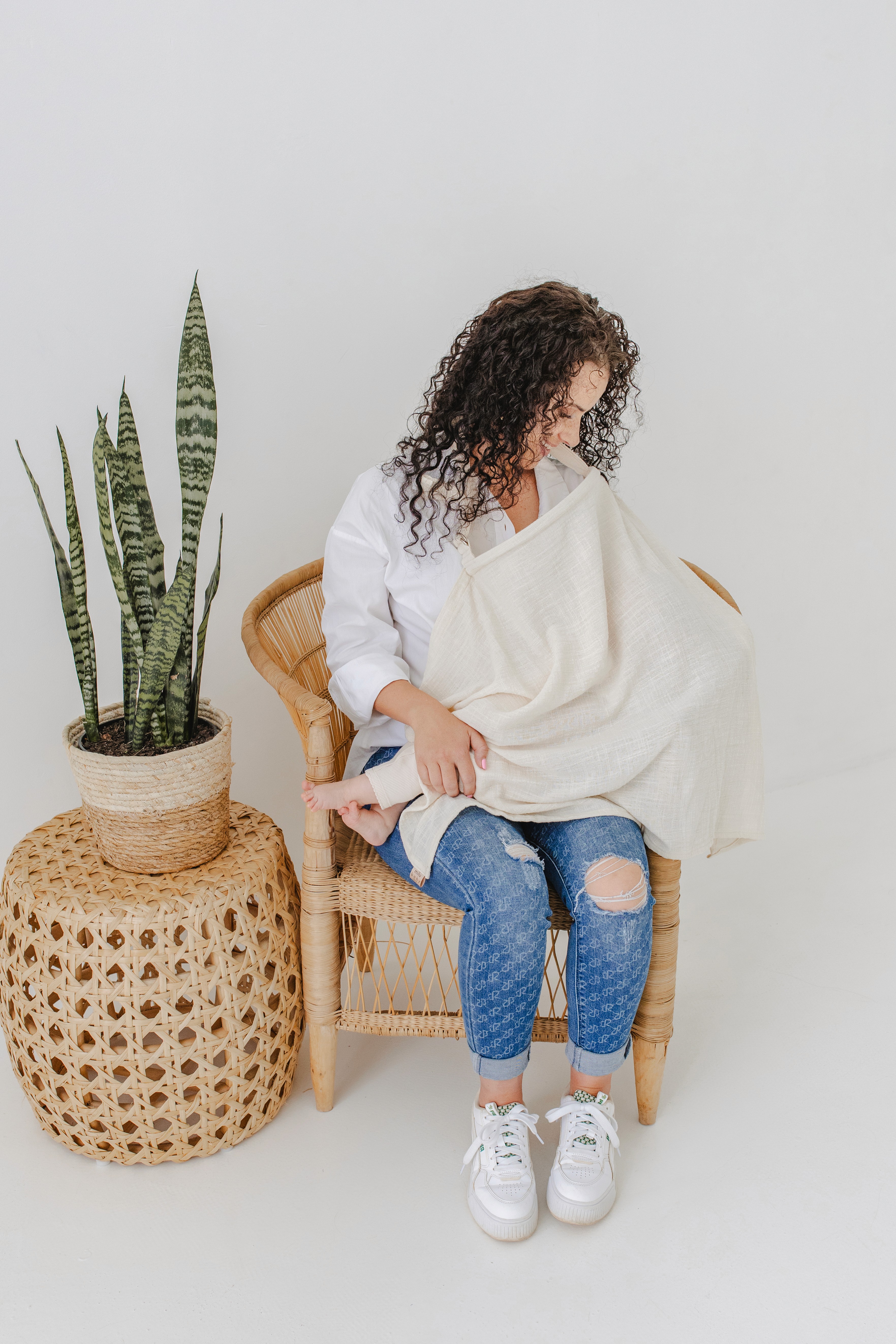 A vibrant bridal bouquet featuring a mix of red, pink, and purple flowers.