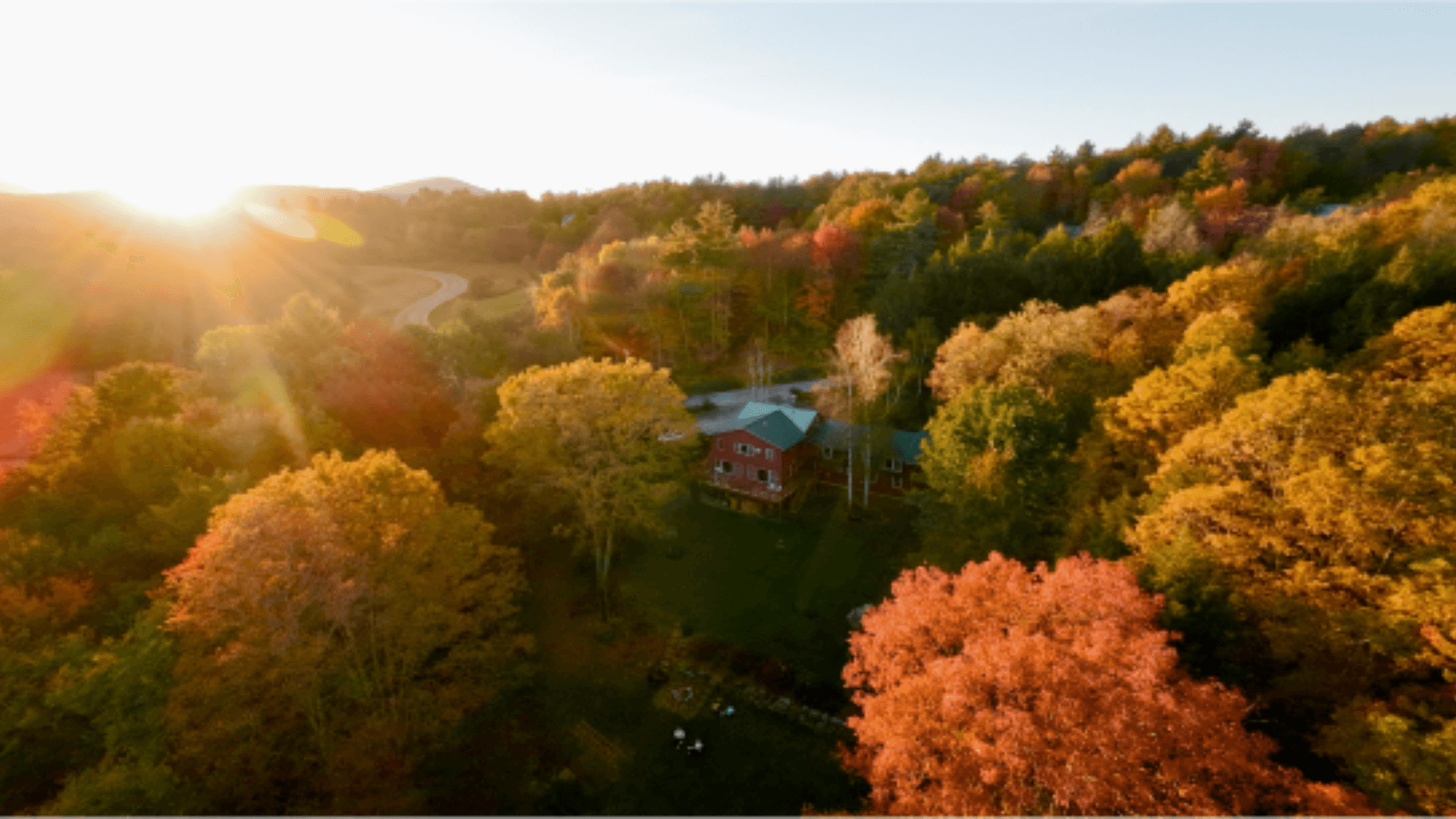 Timberholm Inn view in with fall leaves 