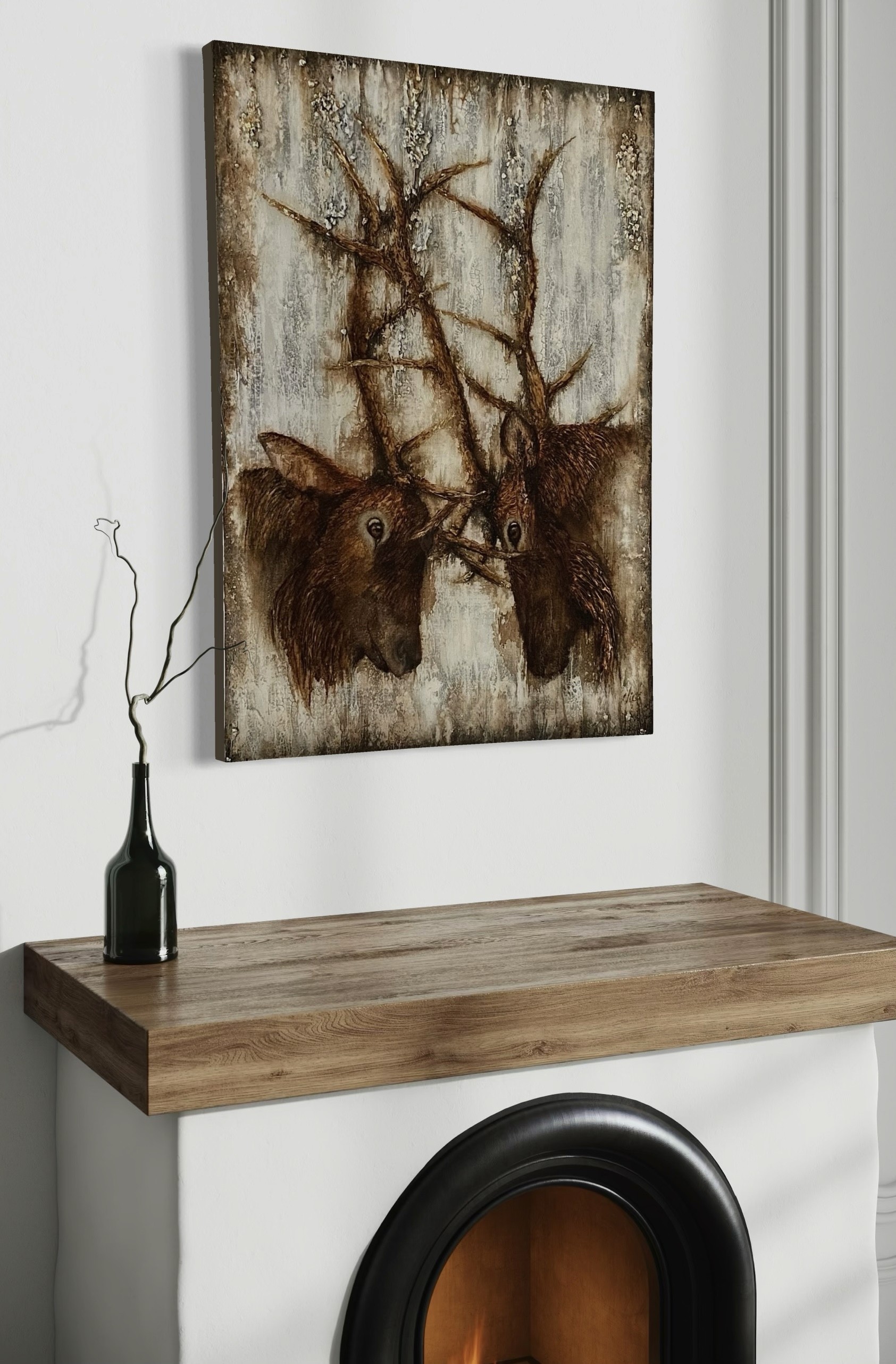 Duel une toile qui met en scène 2 wapiti accroché sur un mur