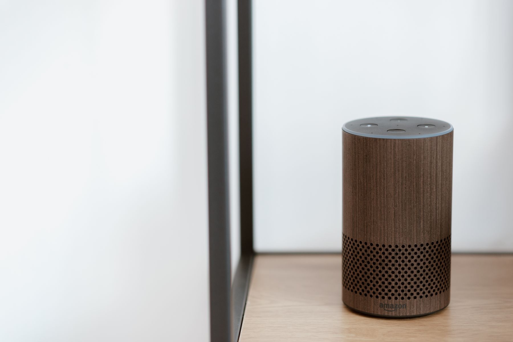 Amazon Echo smart speaker on a wooden surface