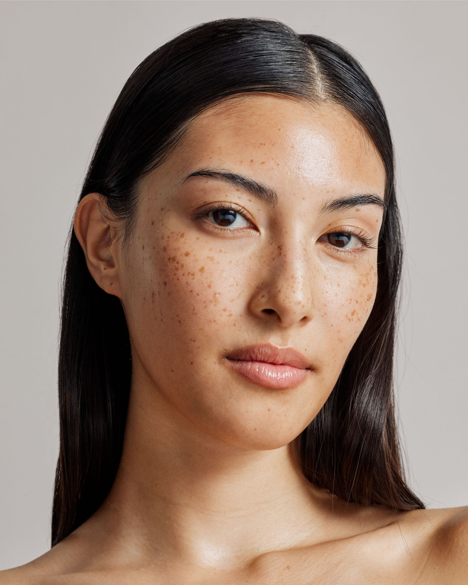 portrait of a young woman with freckles