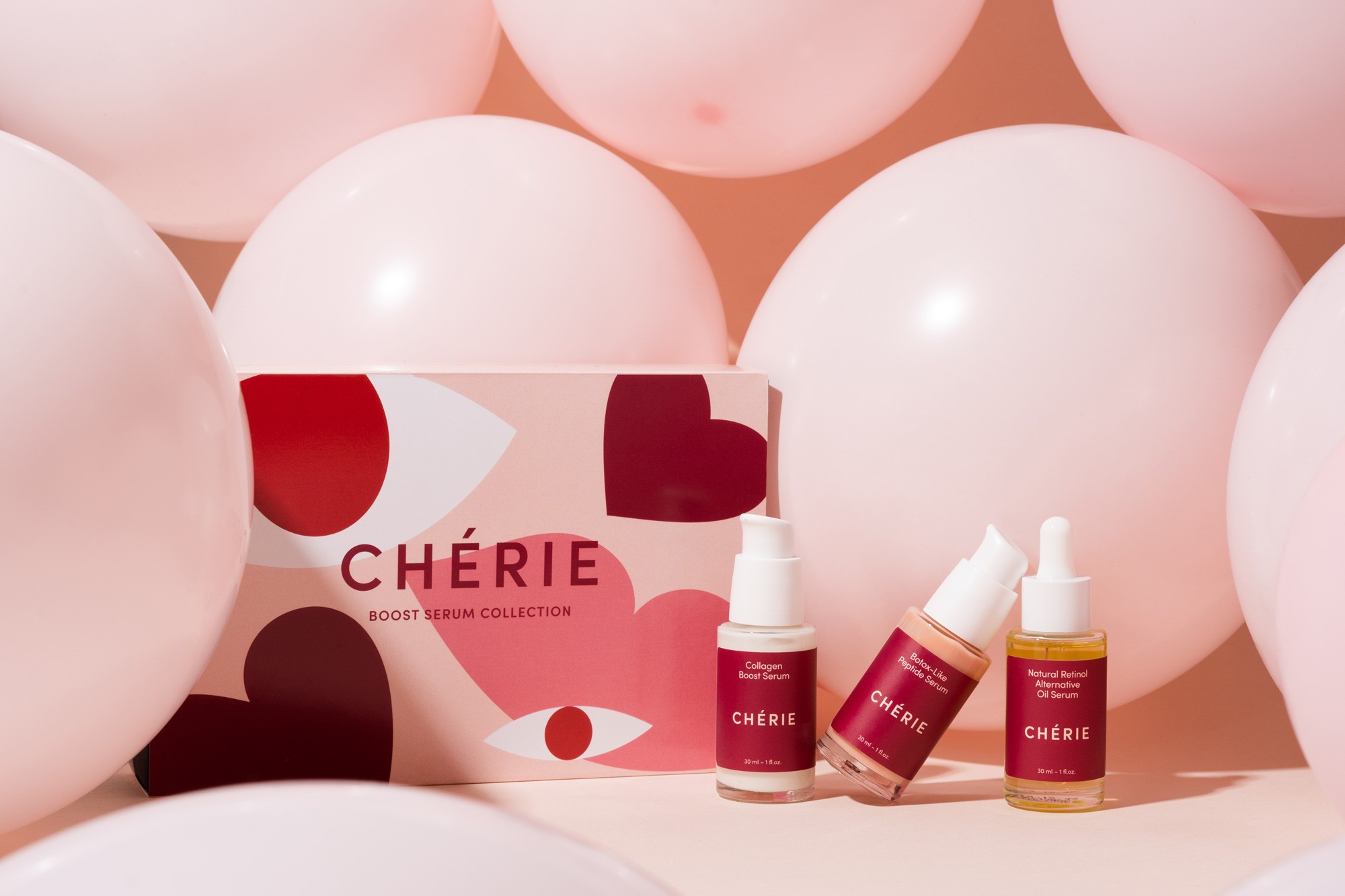 pink baloons and pink skincare products