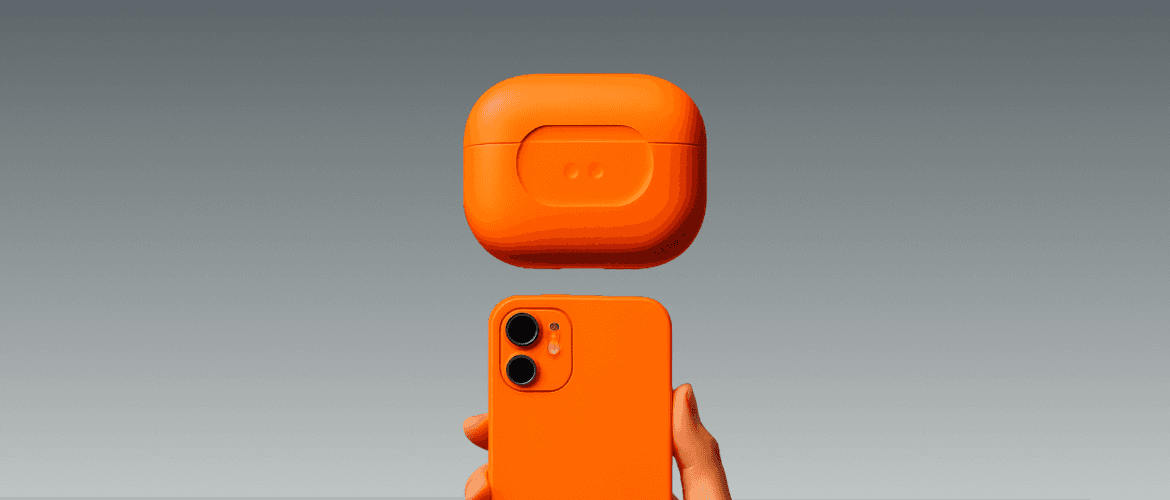 Orange square-shaped device held in hand, showcasing bold product design