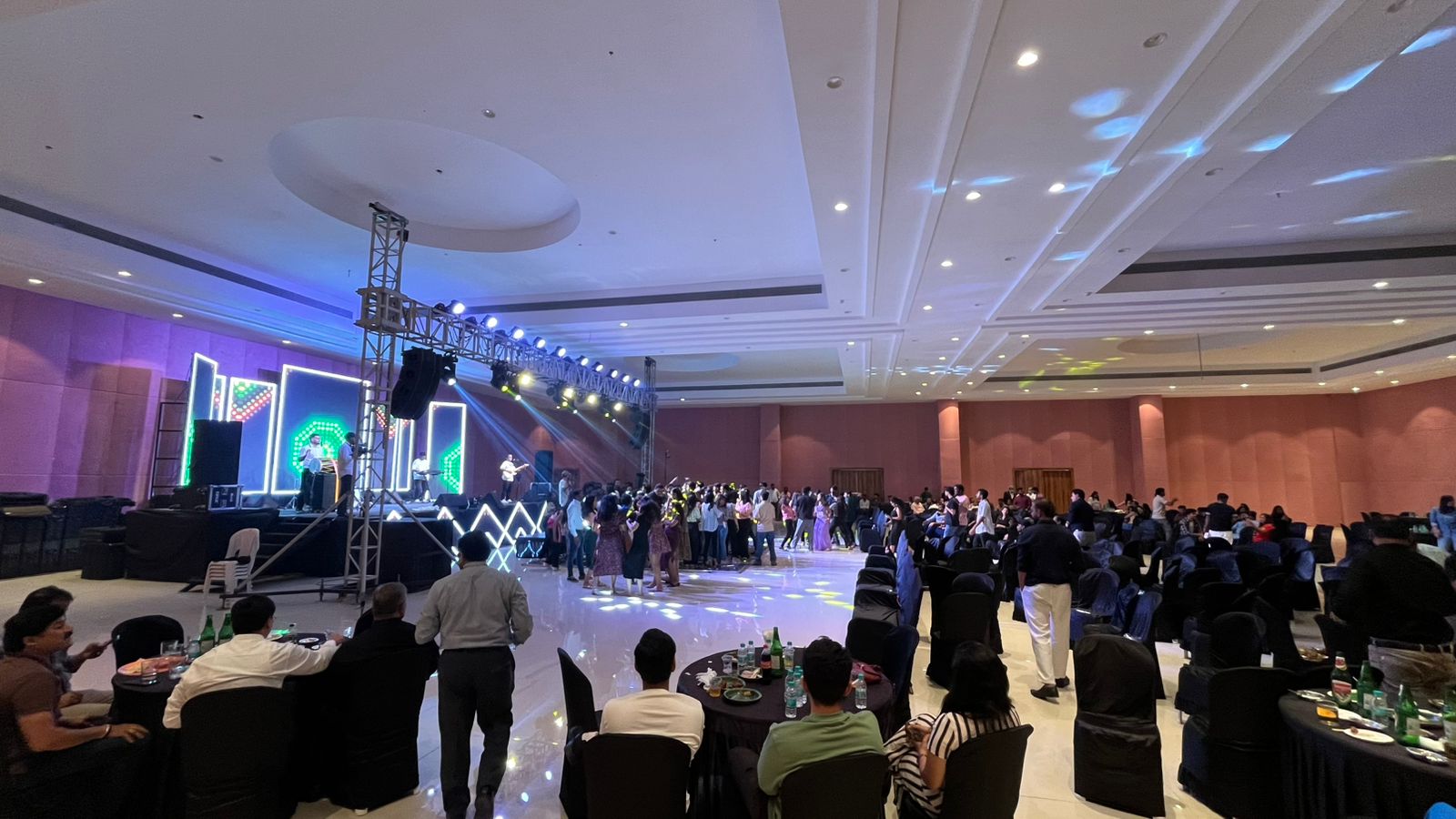 A large room with rows of tables and chairs