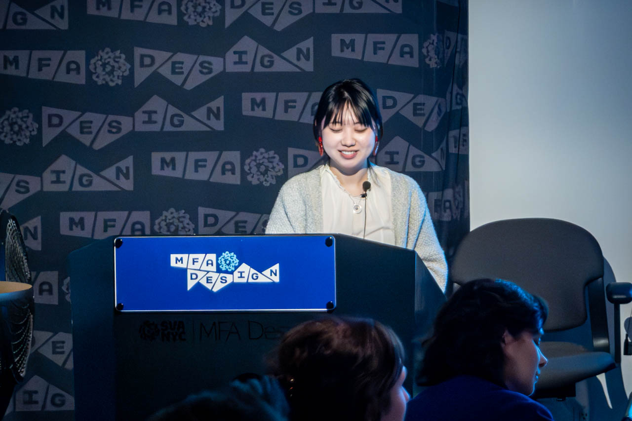 Woman at a podium delivering a presentation