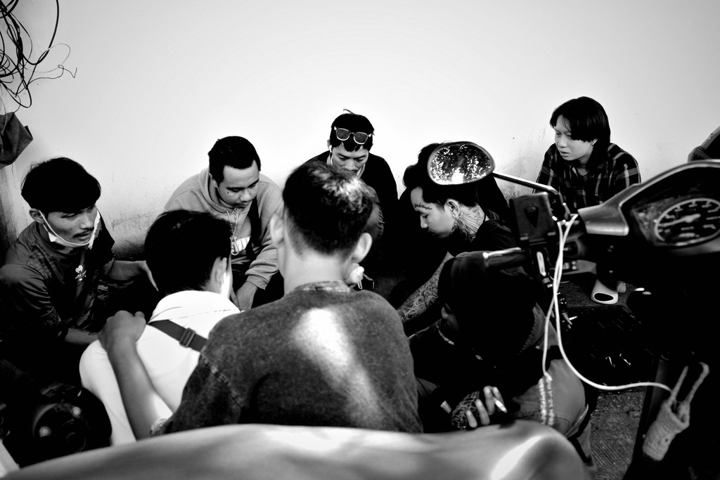 People are gathered, seemingly in discussion, together.
