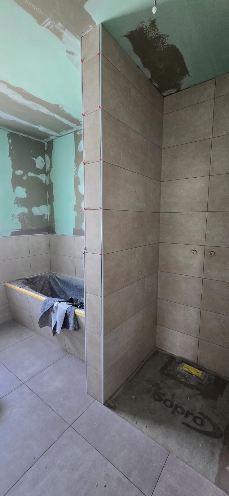 white and brown house near green grass field under white clouds and blue sky during daytime