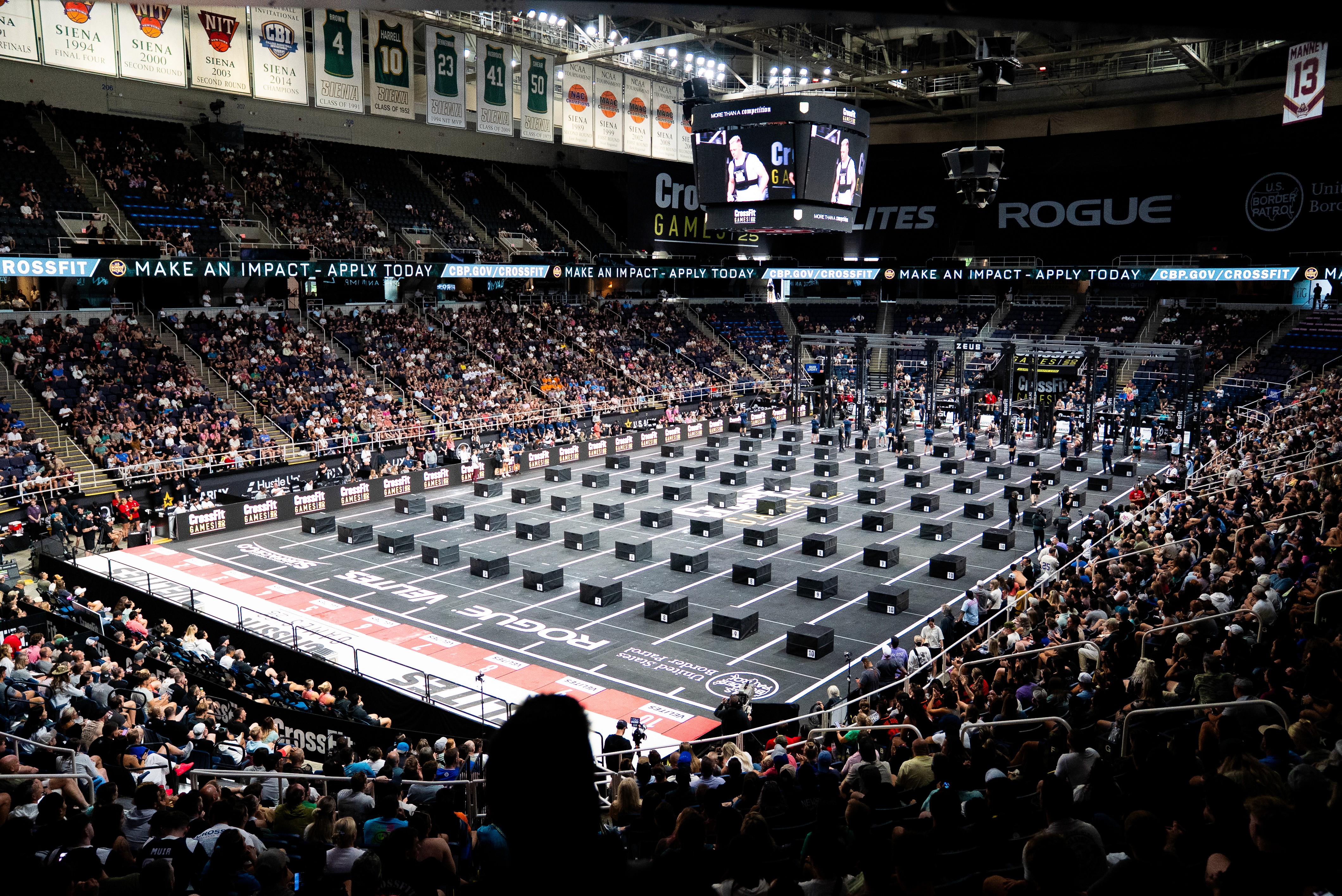 A man wearing a virtual reality headset, immersed in a digital experience, with a focused expression on her face.