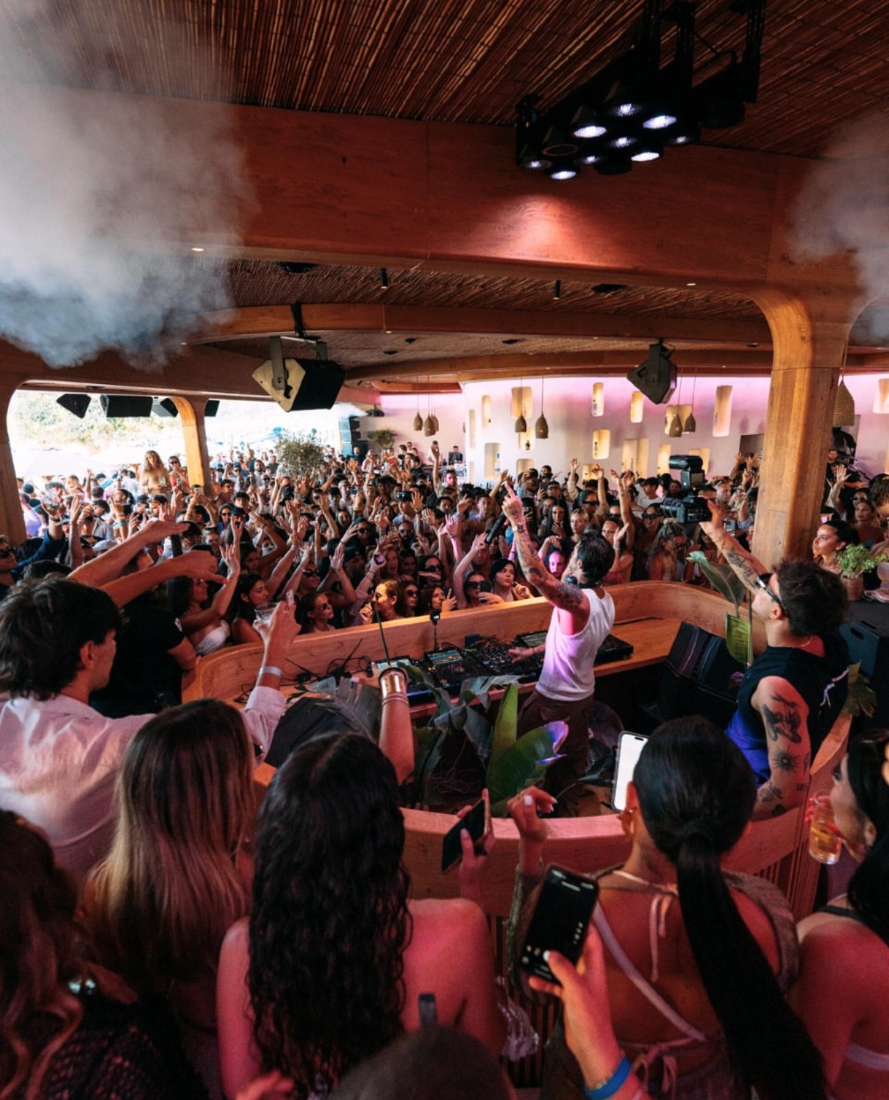 Singer crowd surfing at outdoor concert