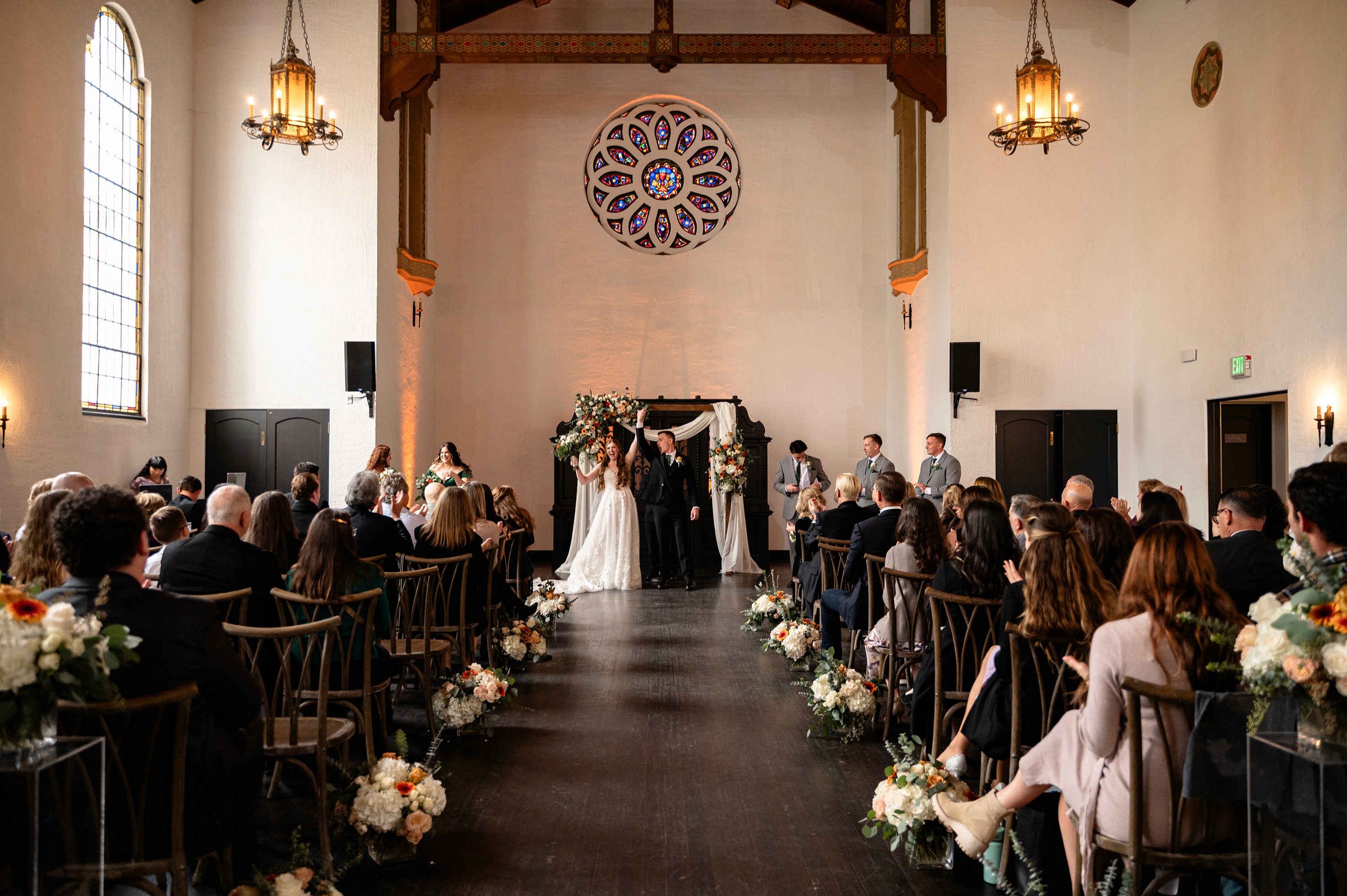 Flat lay wedding details with bouquet, rings, and sparkling bridal heels
