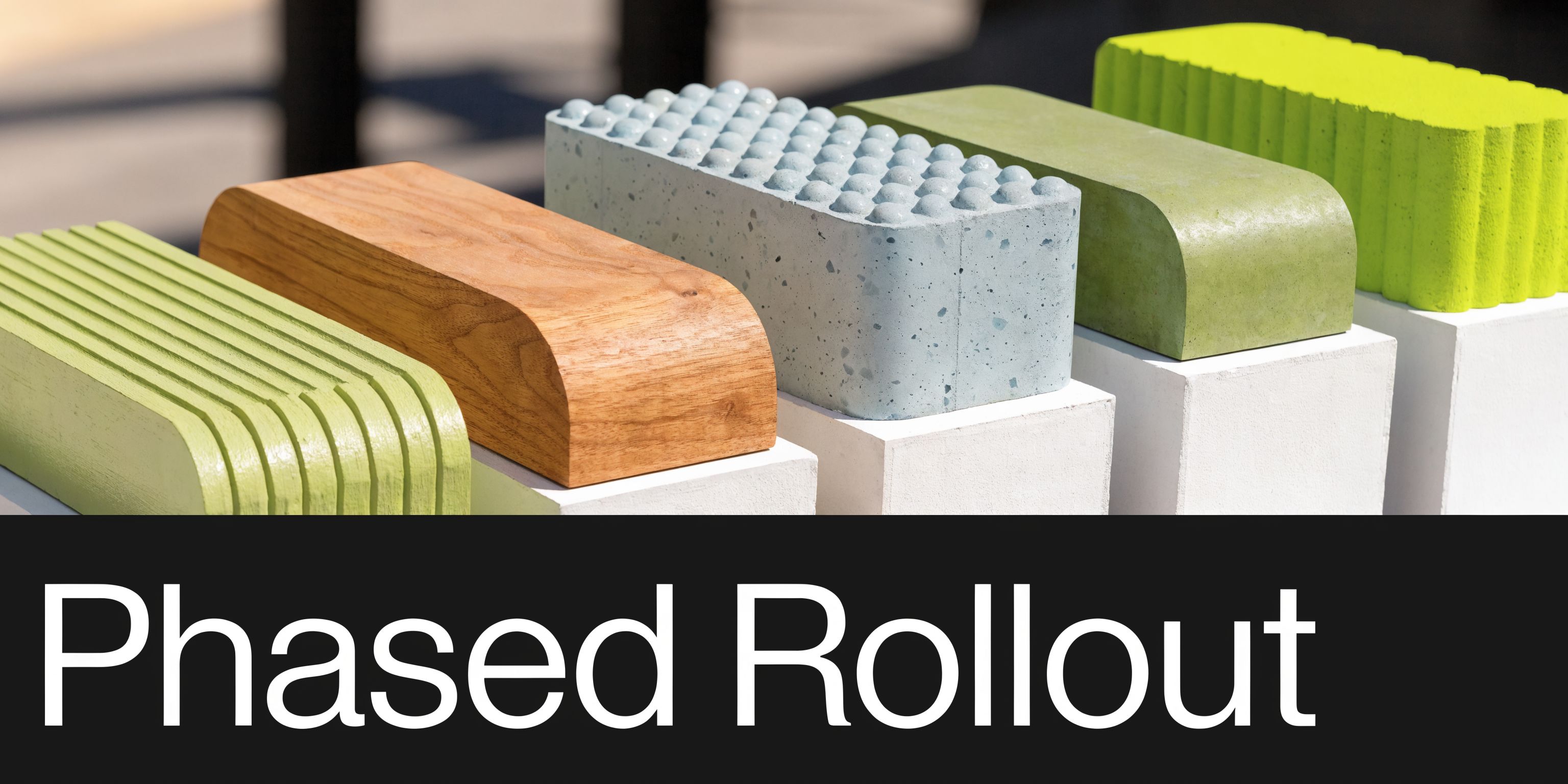 A row of various textured rectangular blocks in different materials and colors arranged on white pedestals.