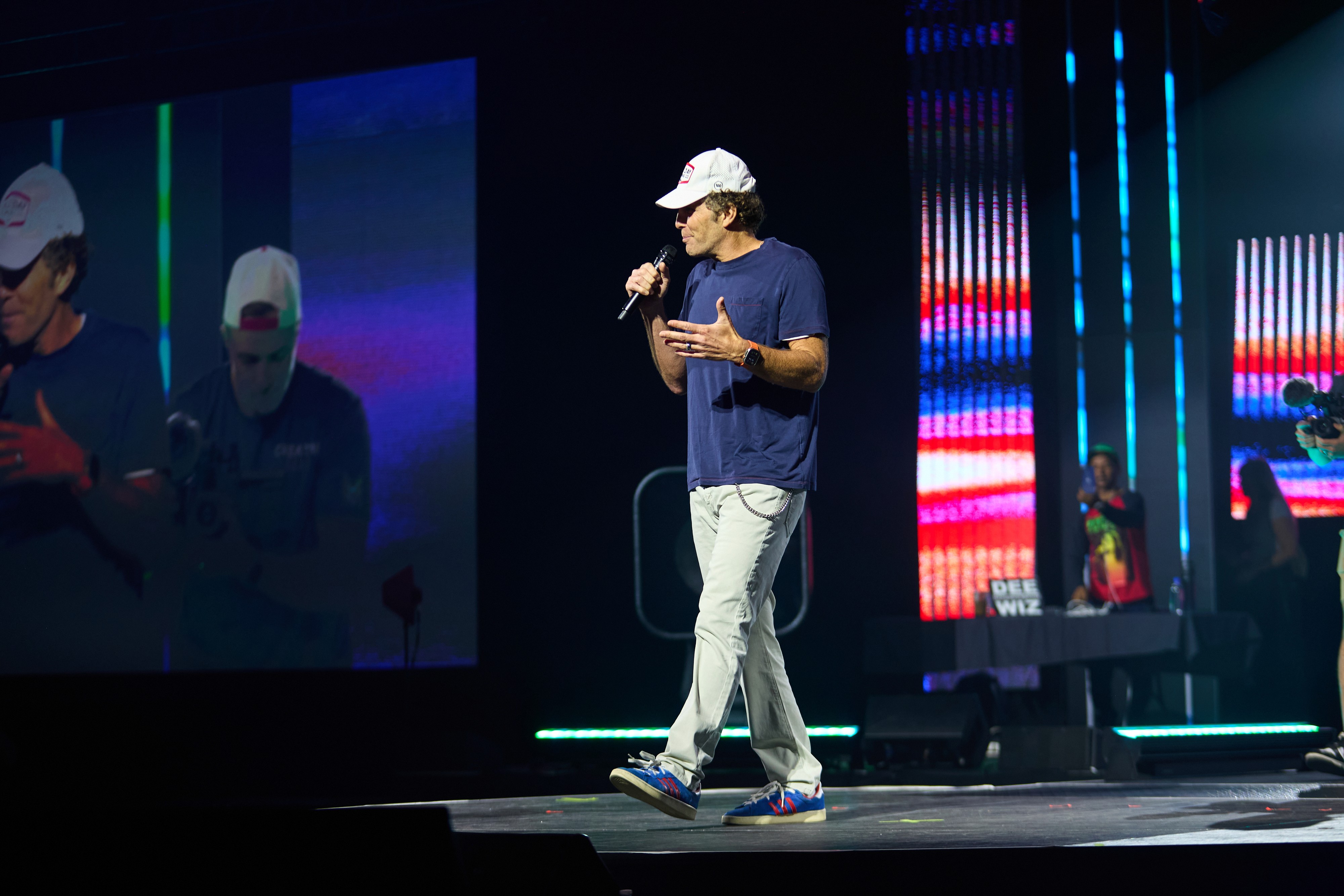 A person stands in a sandstone cave.