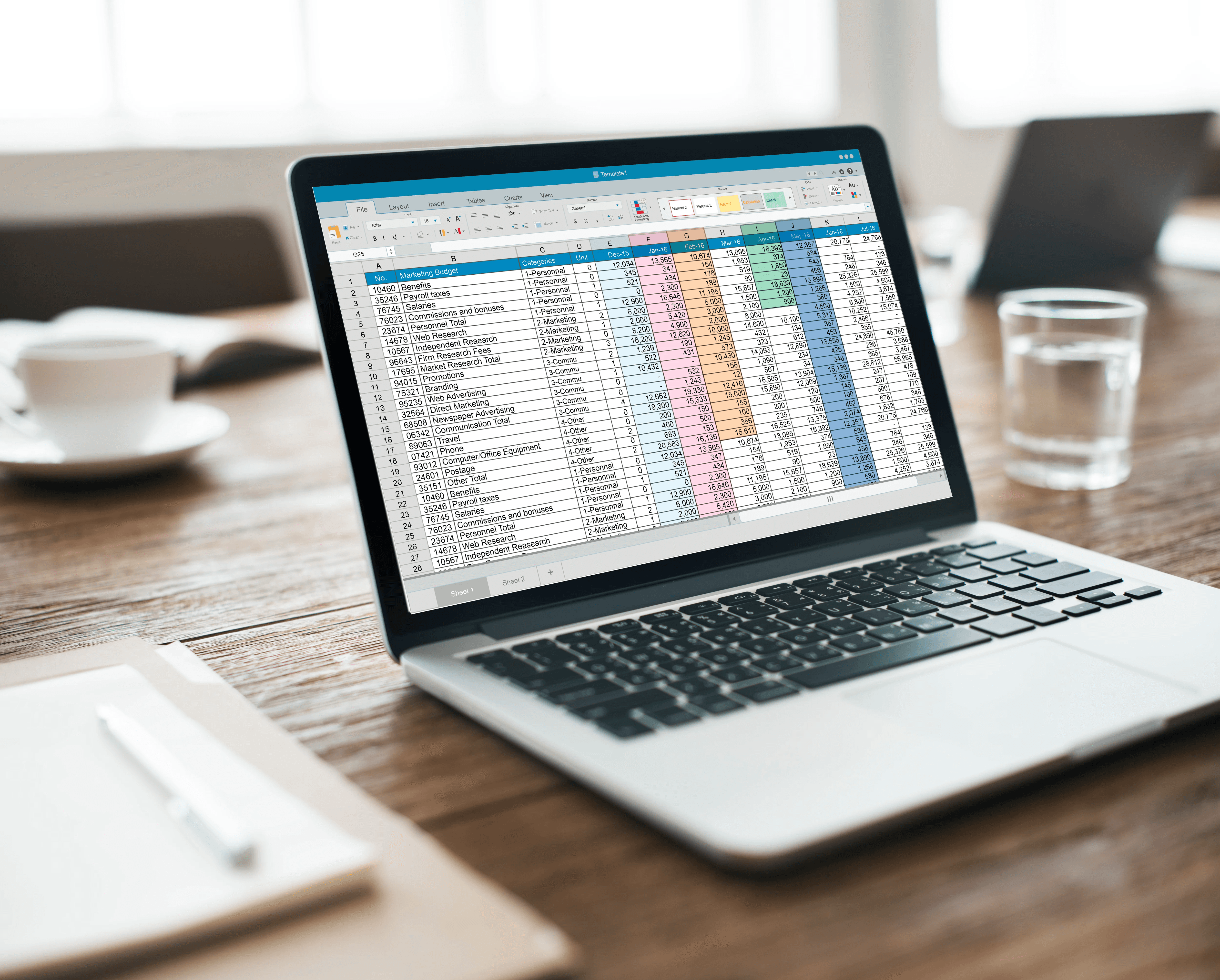Laptop on desk displaying financial spreadsheet -  How to View Hidden Sheets in Excel