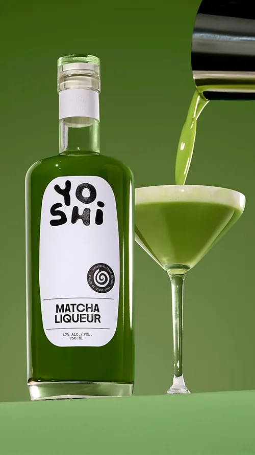 a green smoothie and a smoothie drink on a table