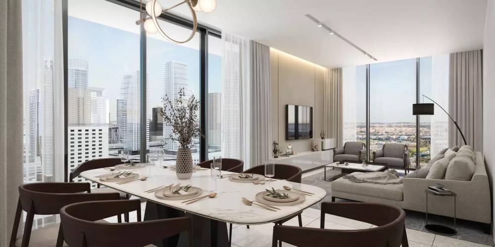 A modern living room featuring a large flat screen TV, designed with contemporary furnishings at Sobha Verde.