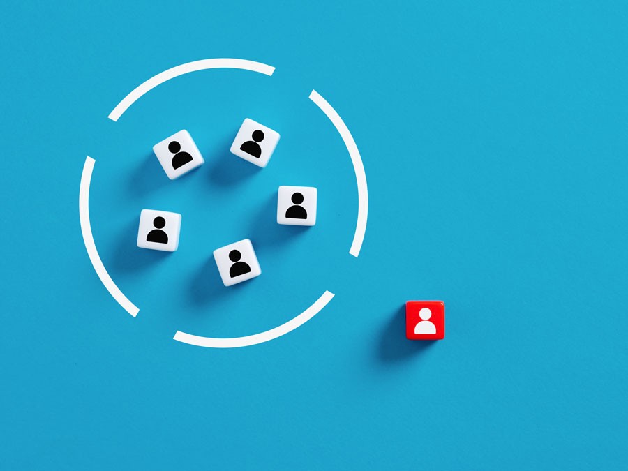 A circular arrangement of user icons, with a lone user icon excluded outside of the circle and highlighted in red.