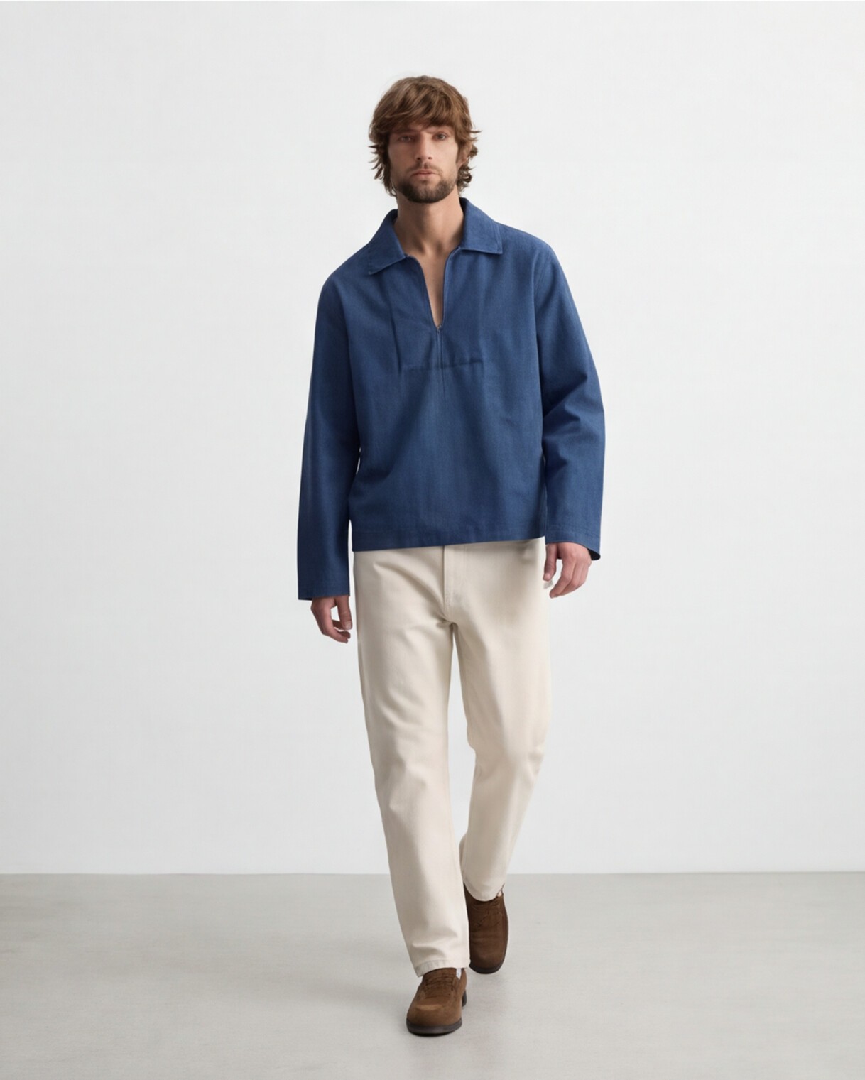 Indigo Pullover Shirt with Cream Trousers