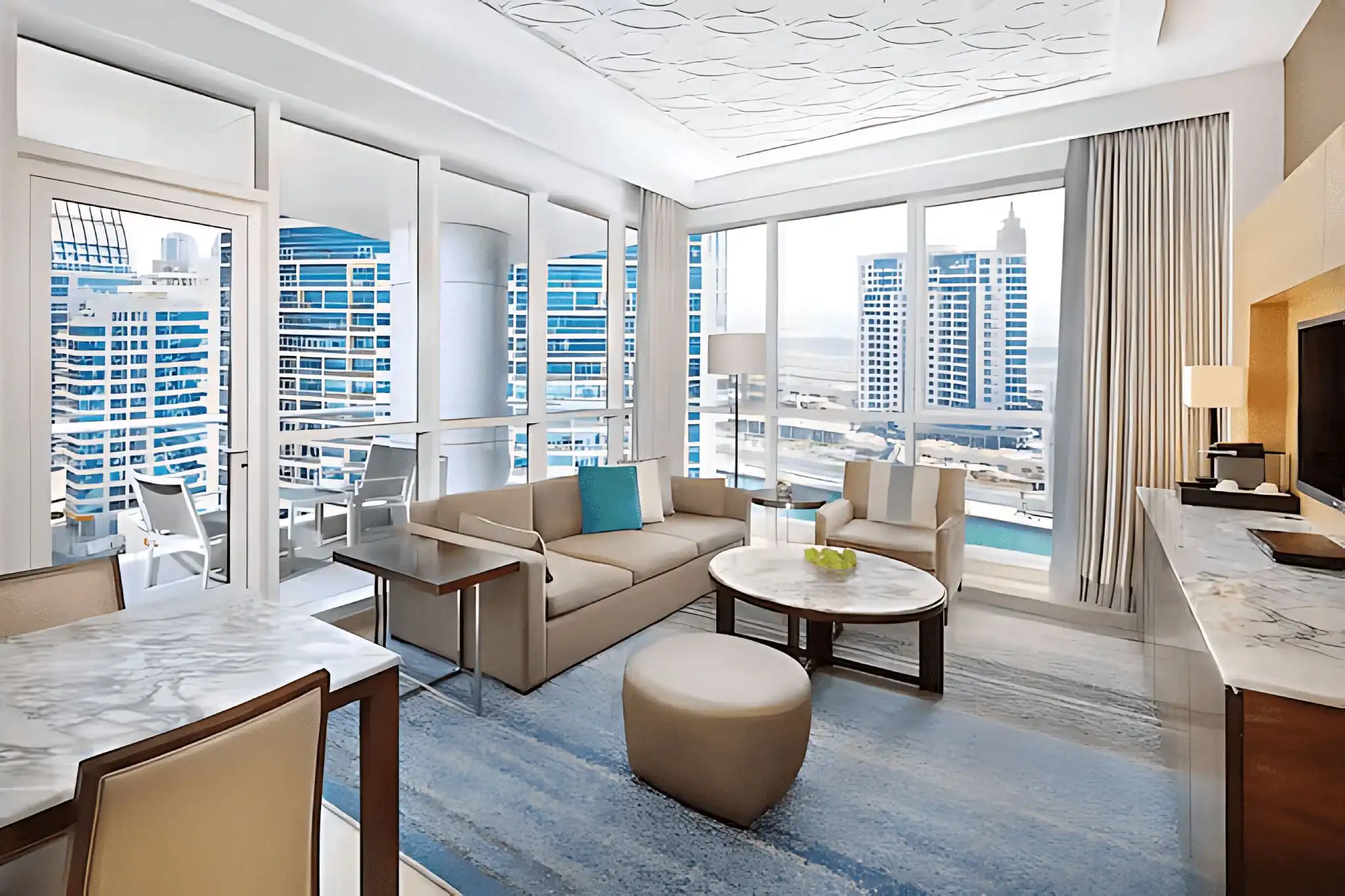 A compact guest room with balcony at DoubleTree by Hilton, a pet-friendly hotel near Dubai Marina