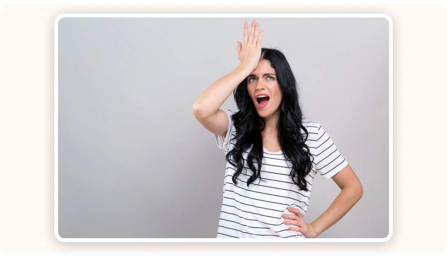 Woman tapping her forehead