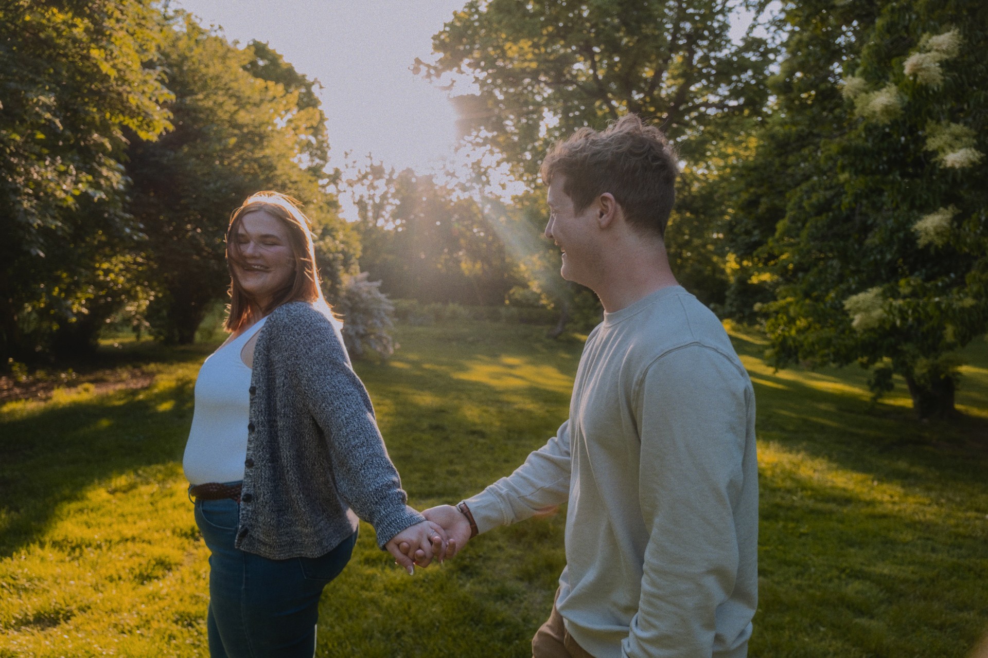 Couple walking through a flower garden